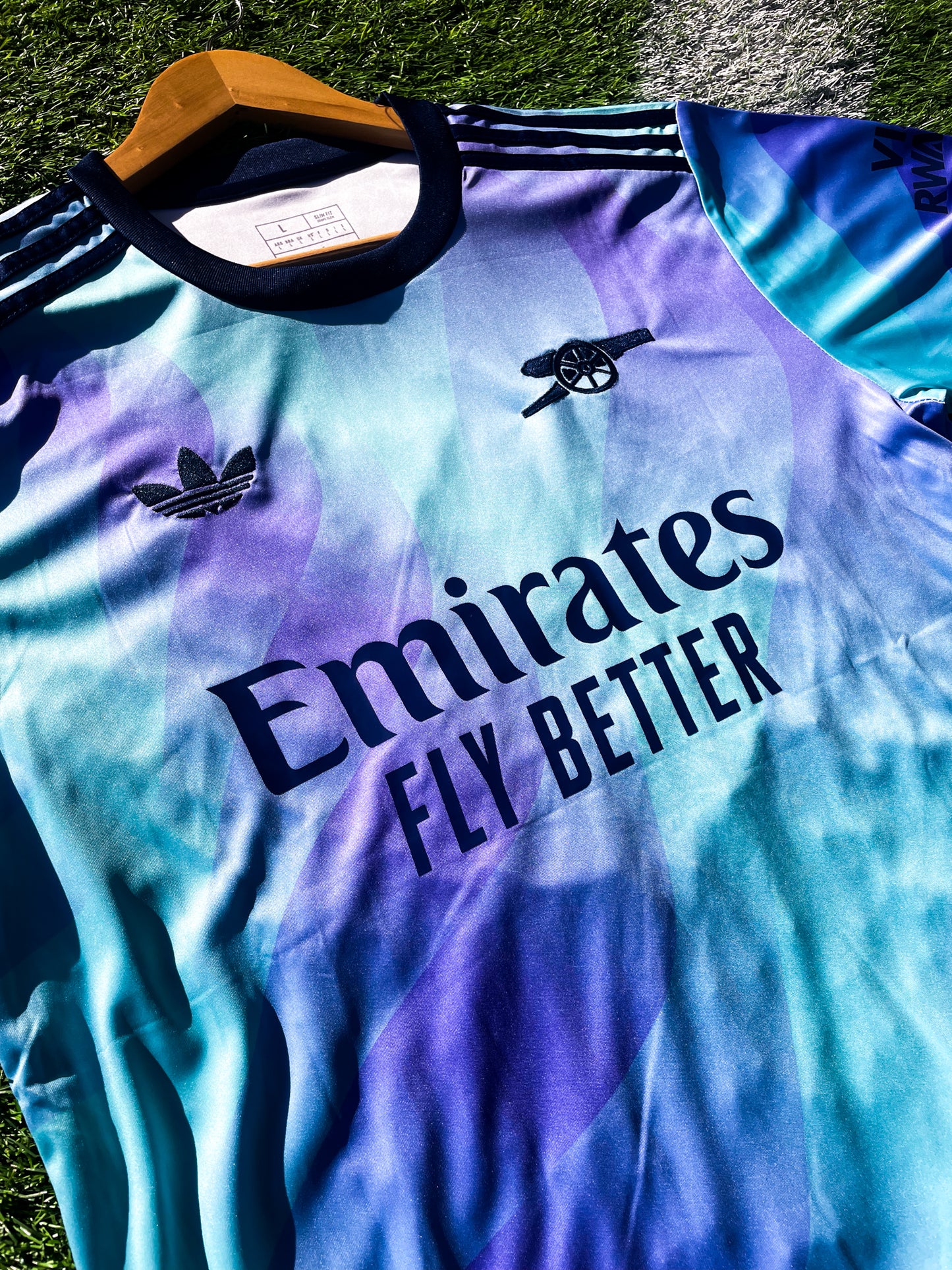 Close-up of Arsenal crest on the bold third kit design