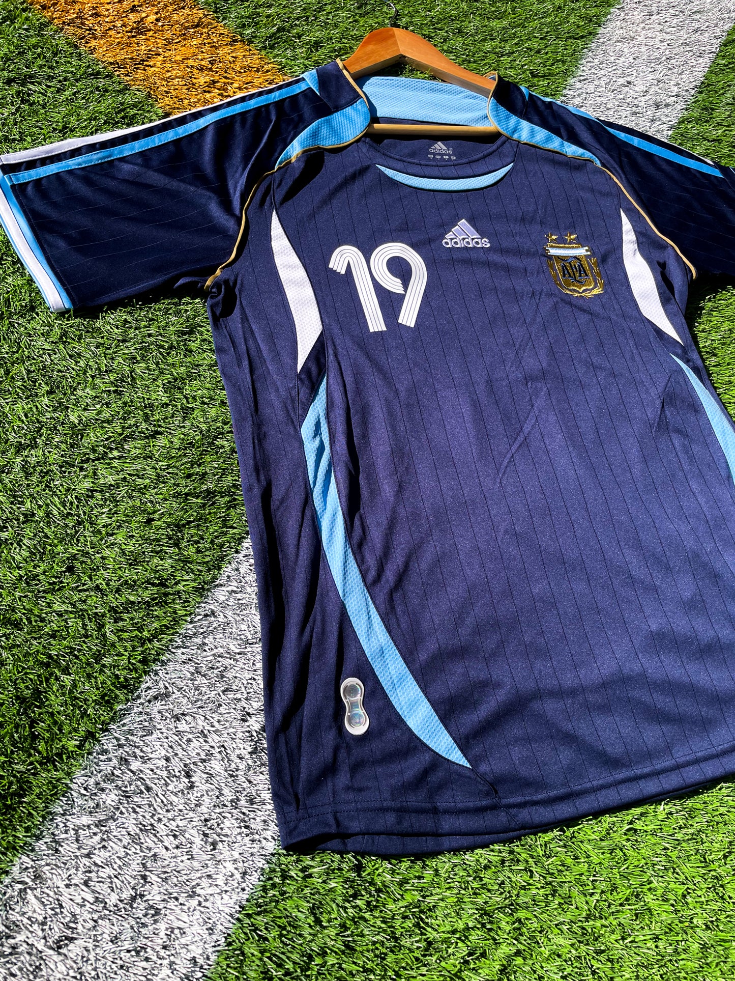 Front view of Argentina 2006 Away Jersey with Messi #19 and AFA crest.