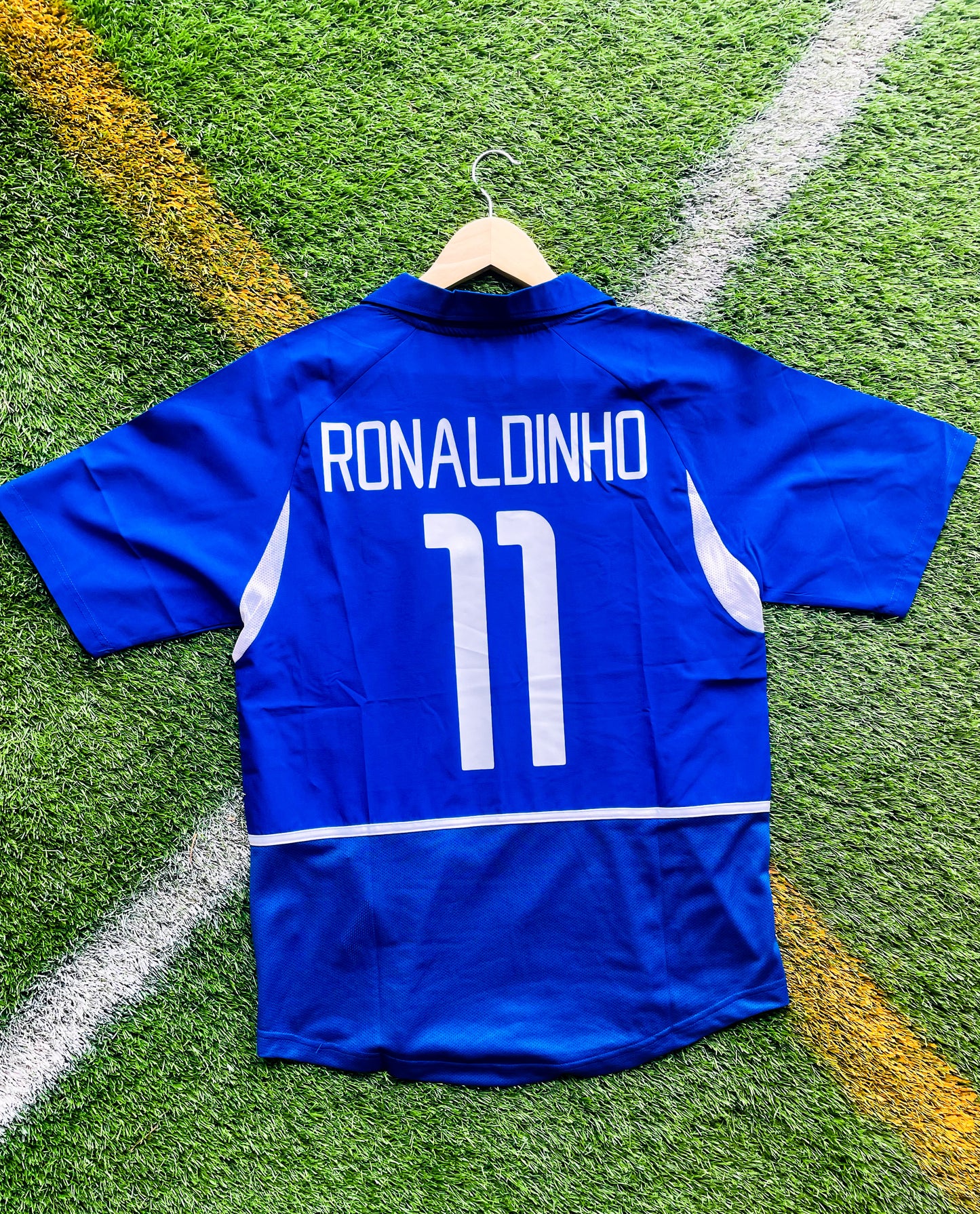 Back view of Brazil 2002 away Ronaldinho #11 jersey showing Ronaldinho’s name and number in blue and white