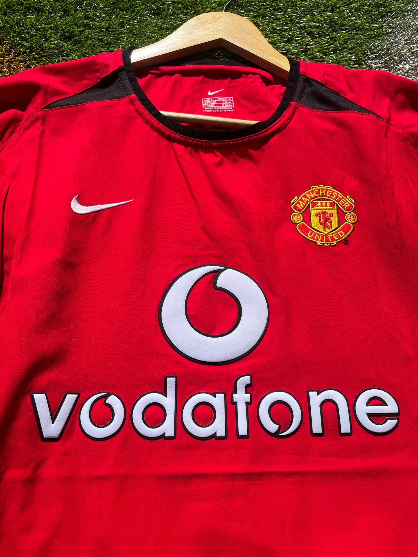 Close-up of embroidered club crest and Nike swoosh