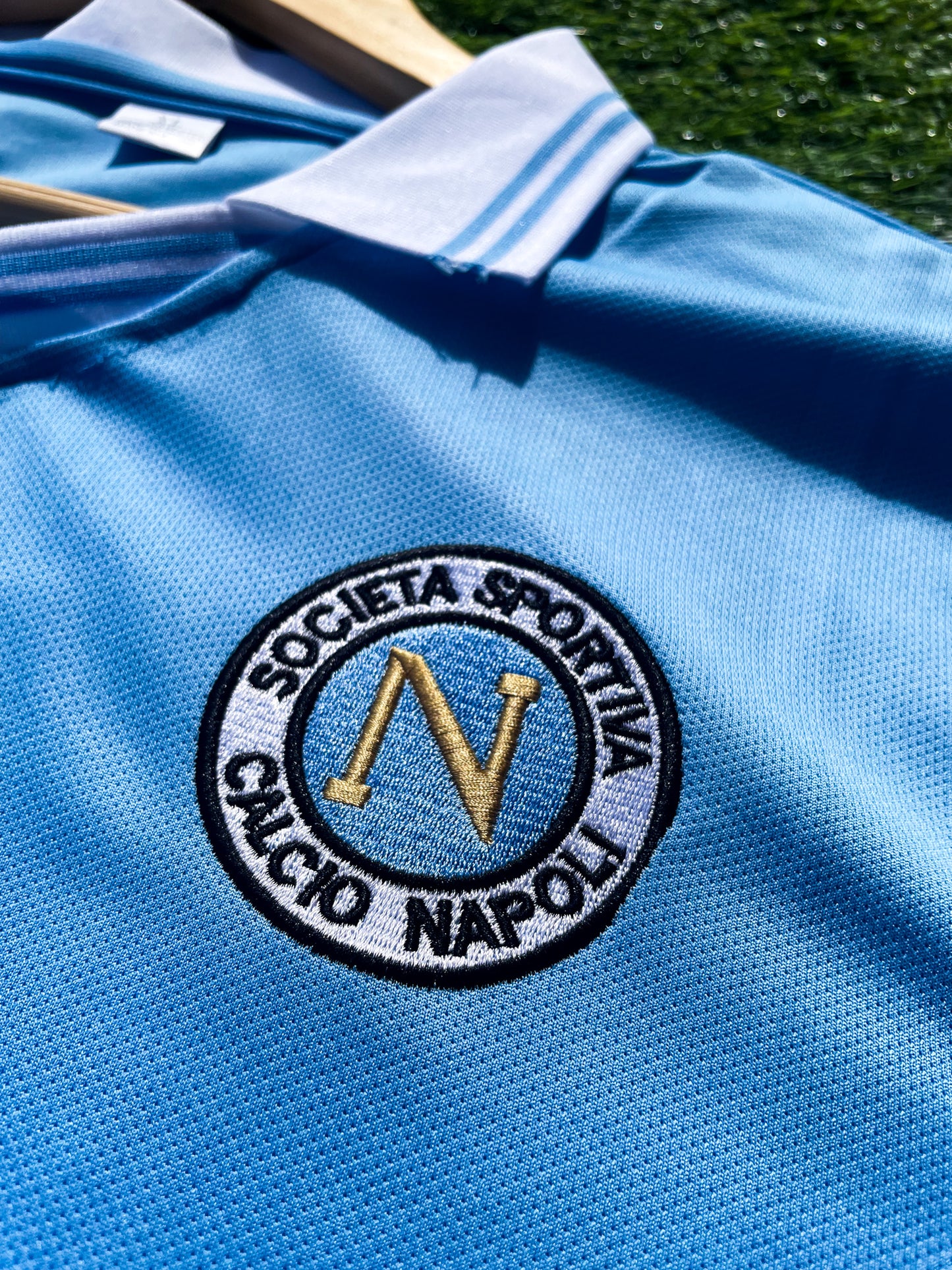 Close-up of Napoli crest and vintage collar detail
