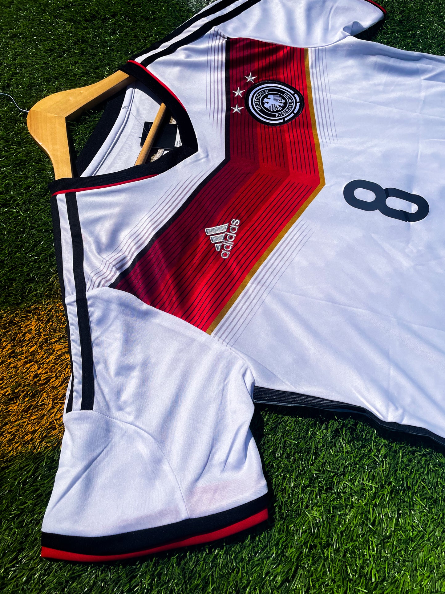Detail of red chevron design and sleeve piping