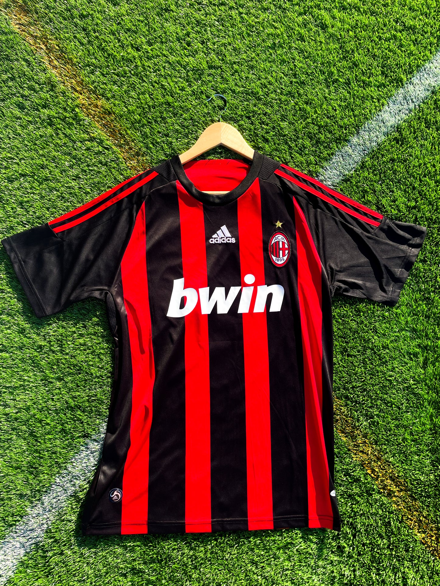 Front view of AC Milan 2008-09 Home Ronaldinho #80 jersey with red and black stripes
