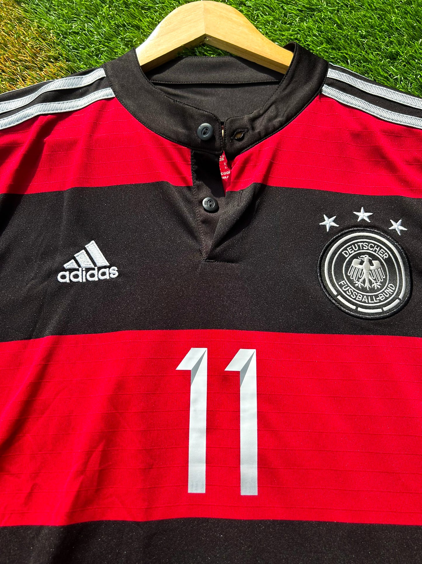 Close-up of DFB crest and Adidas logo on chest