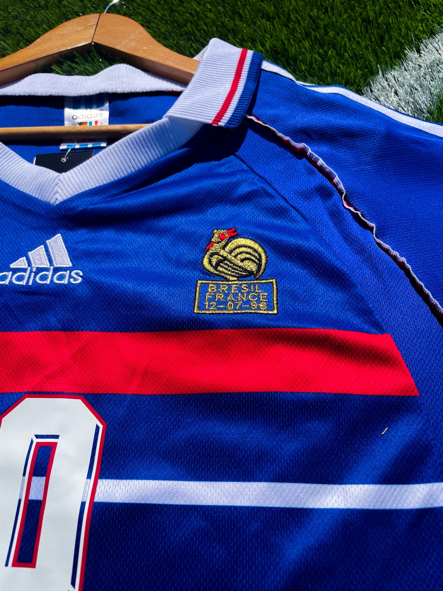 Close-up of France national team crest and Adidas branding
