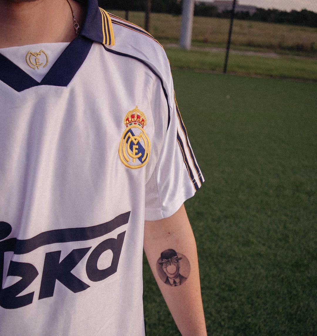 Vintage white Real Madrid home kit styled on a neutral background