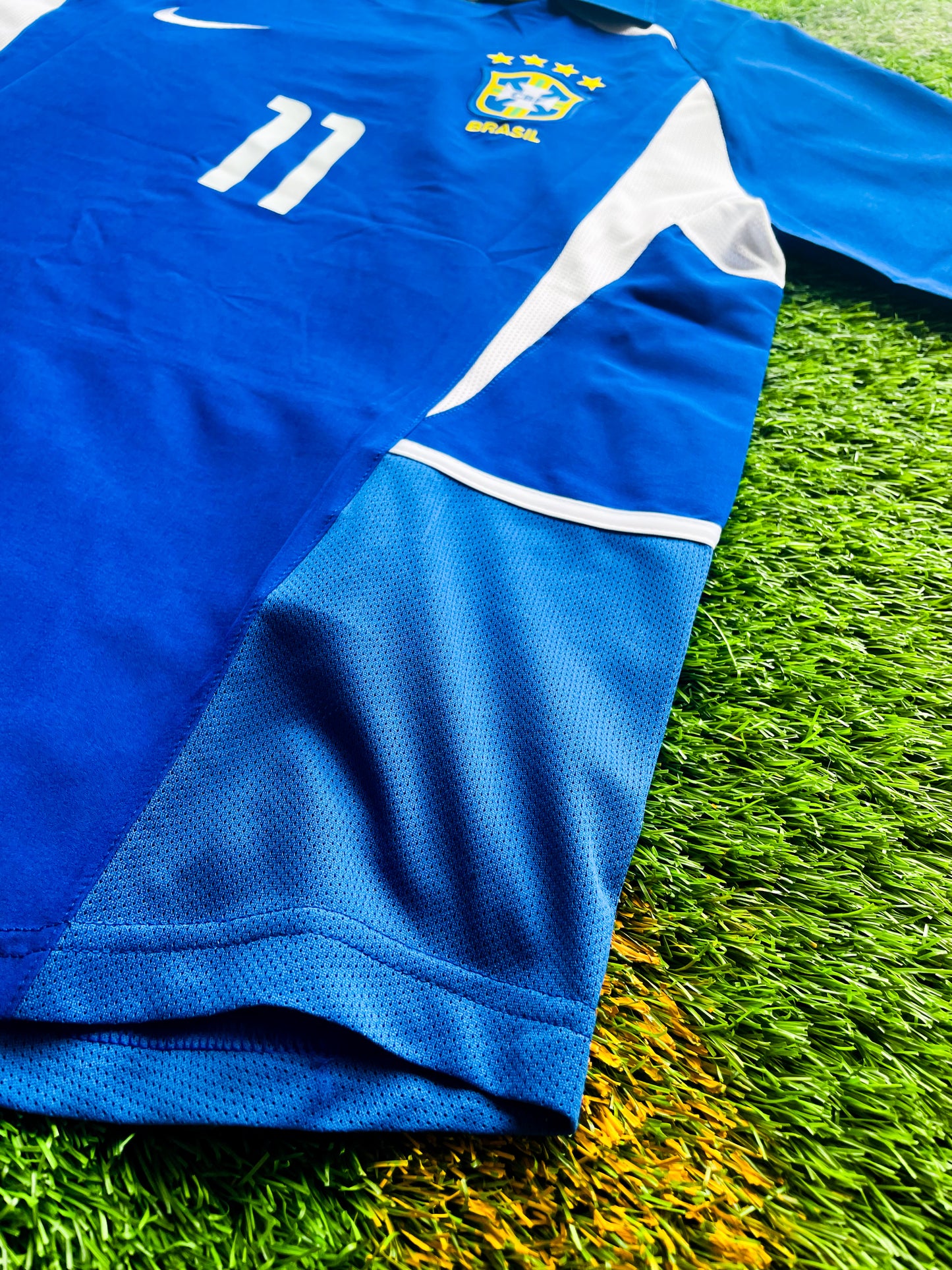Front view of Brazil 2002 away Ronaldinho #11 vintage World Cup champions soccer jersey in blue and white