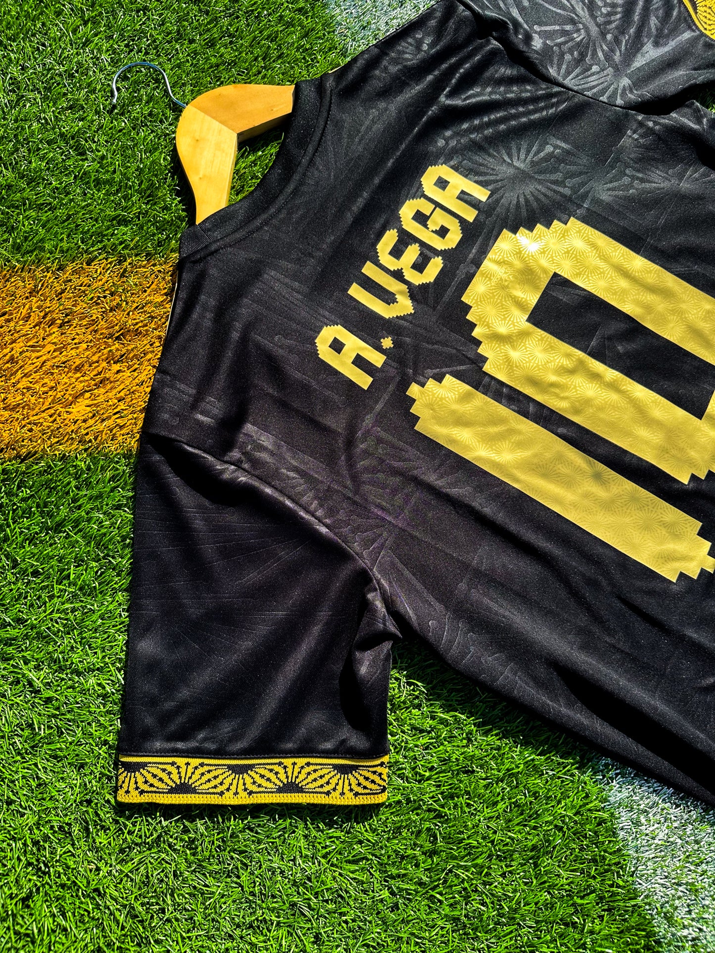 Back view showing A Vega #10 print on black jersey
