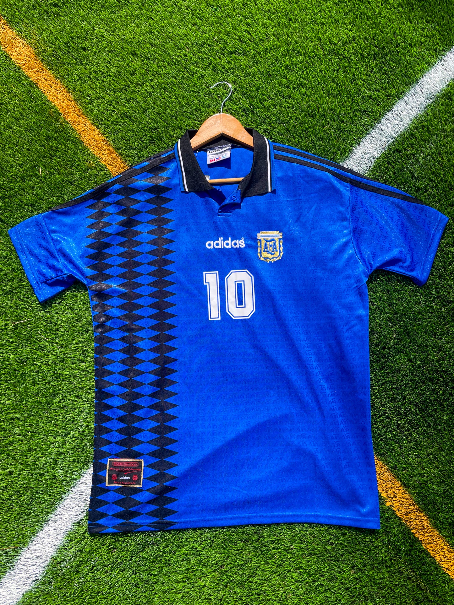 Front view of Argentina 1994 Away Maradona #10 vintage Adidas soccer jersey with classic blue and white stripes