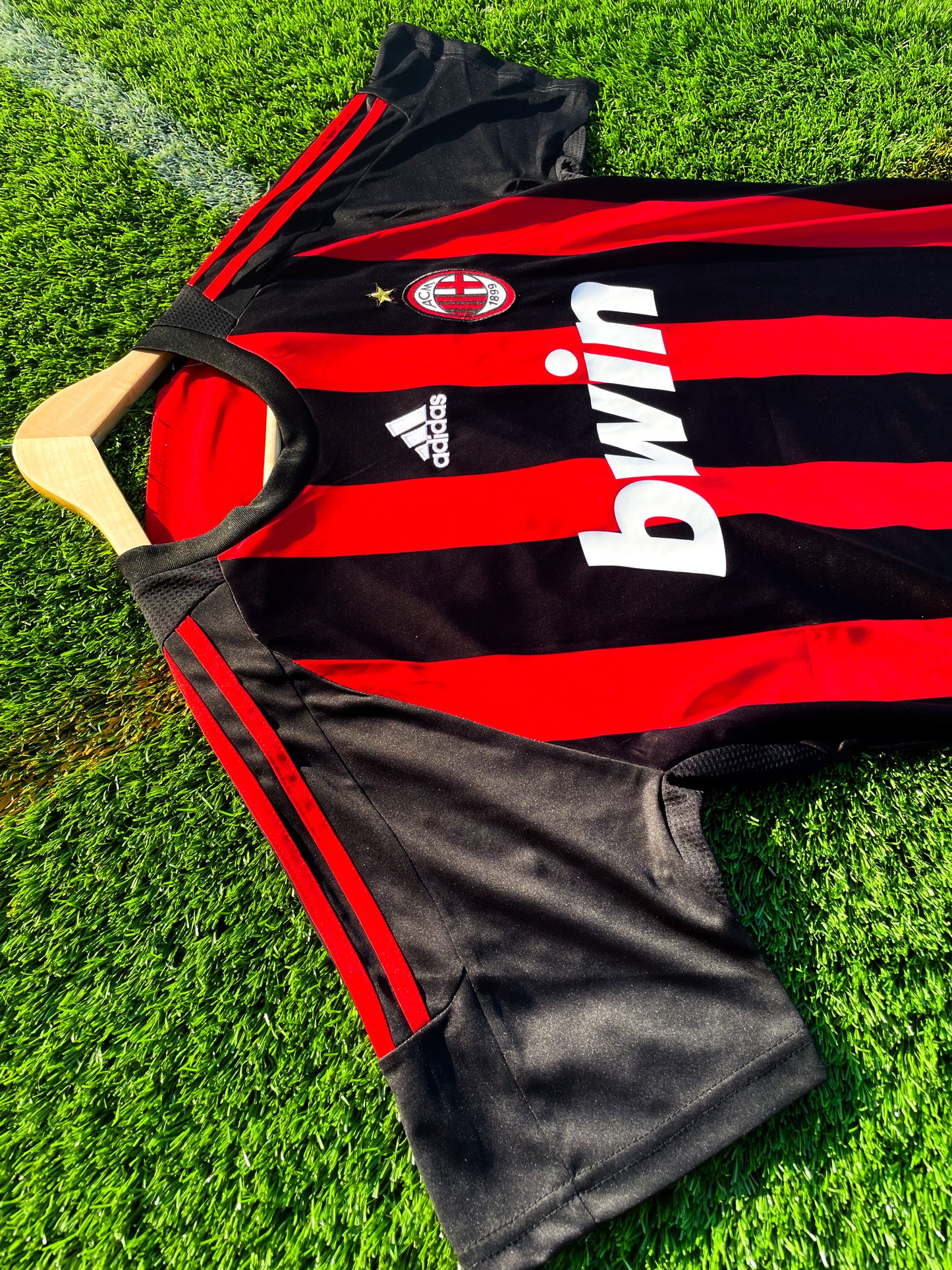 Close-up of Adidas stripes and Bwin sponsor logo