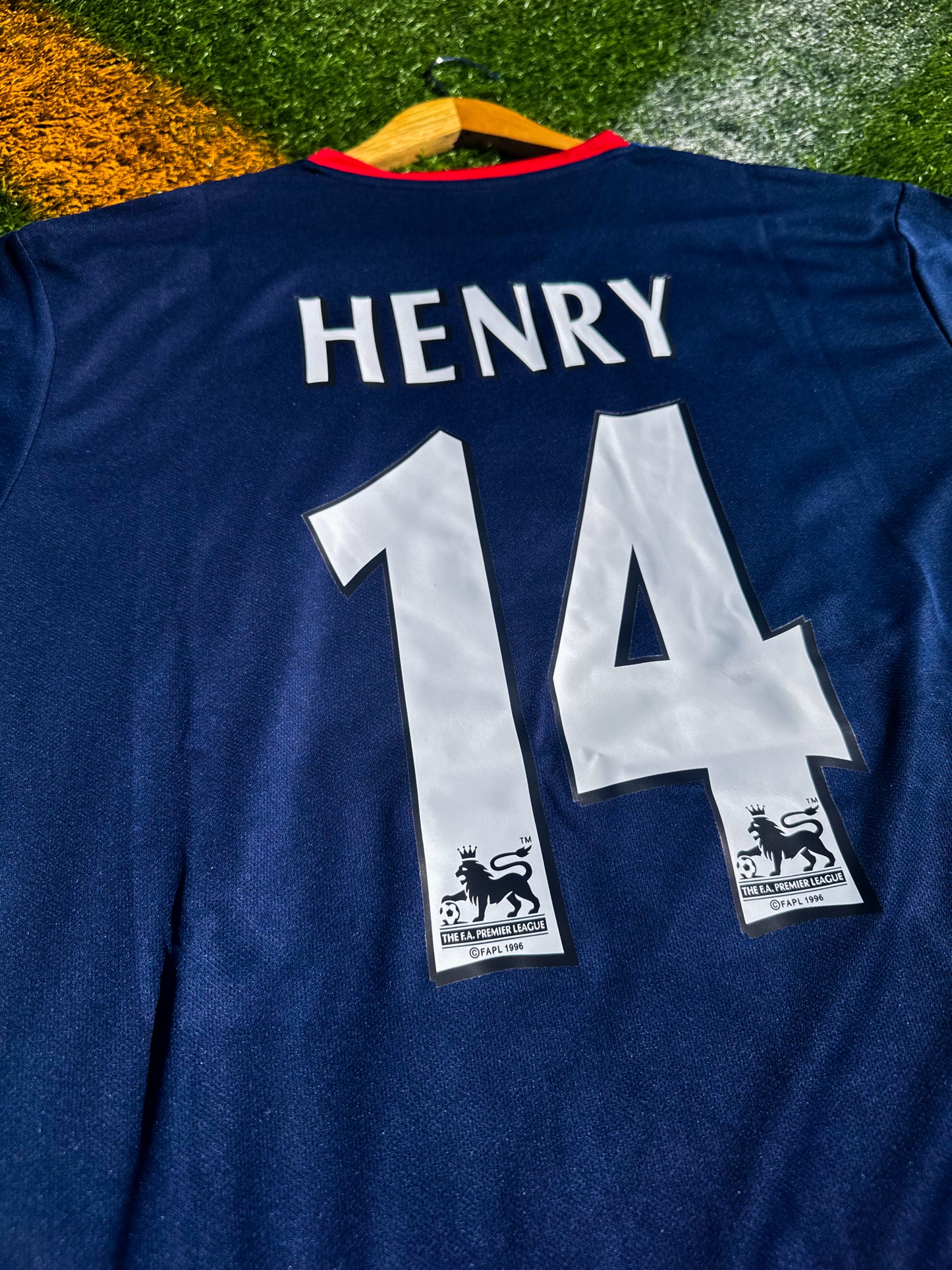 Back view showing Henry #14 in Premier League font on blue Arsenal away kit