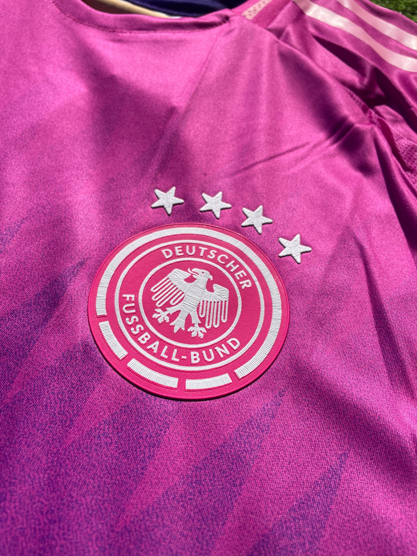 Close-up of Adidas logo and DFB crest on chest