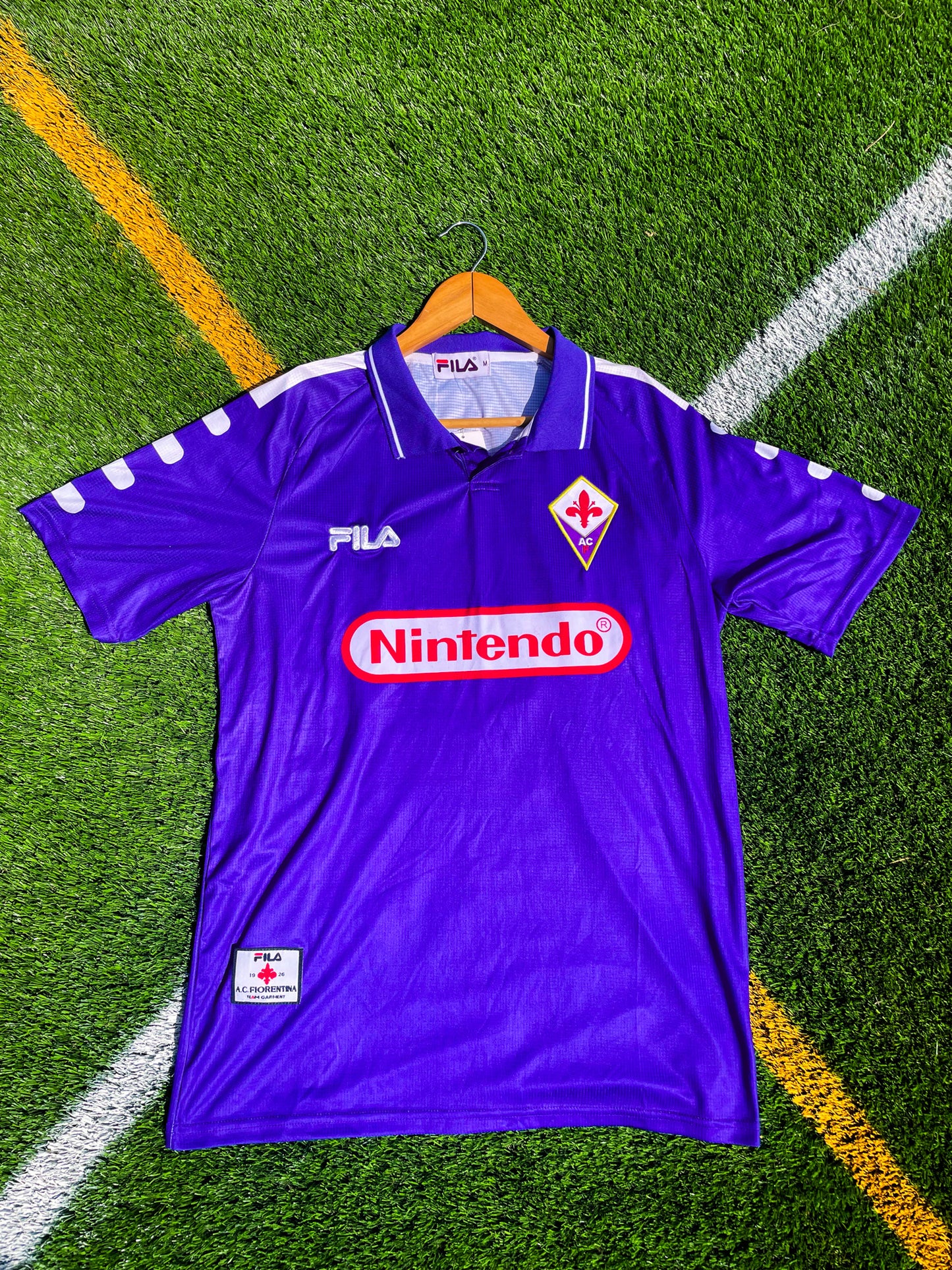 Front view of Fiorentina 1998-99 Home Batistuta #9 jersey in purple with Nintendo sponsor