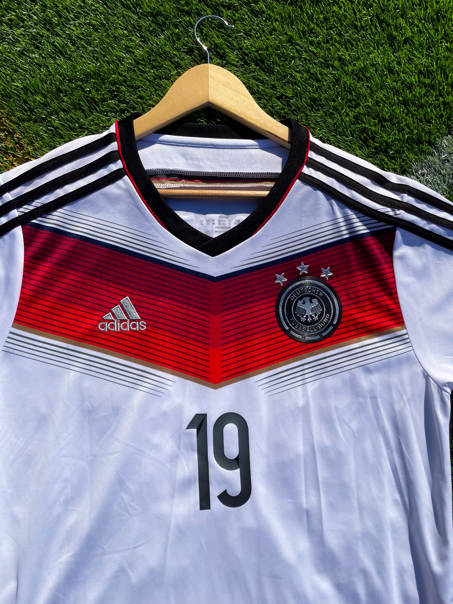Close-up of Adidas logo and DFB crest on chest
