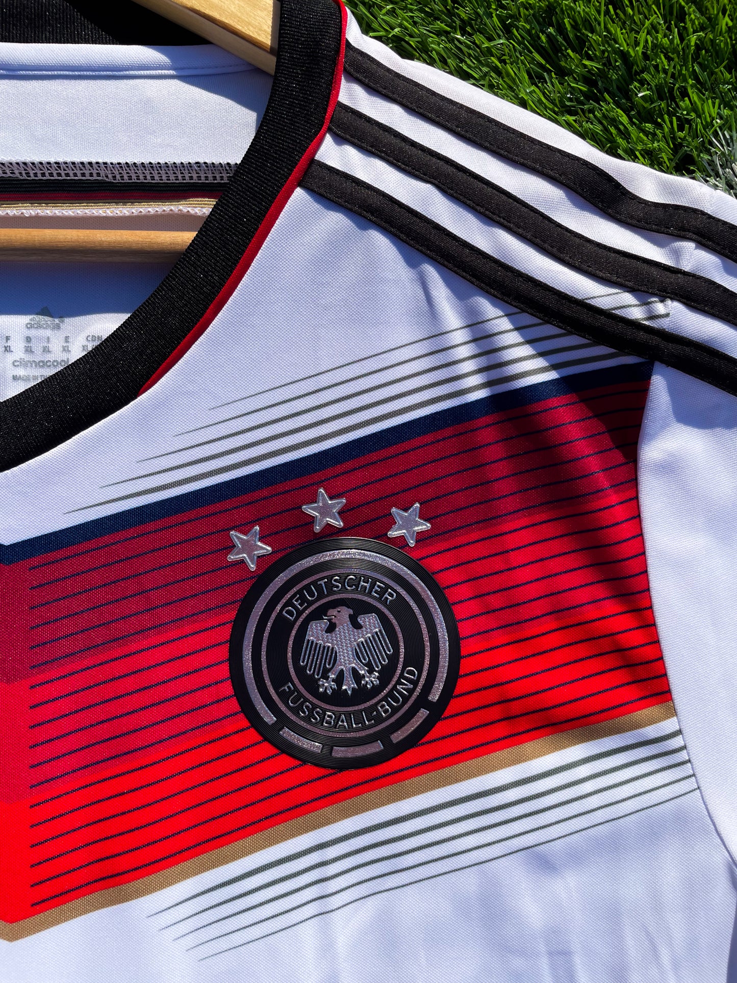 Close-up of Adidas logo and DFB crest on chest