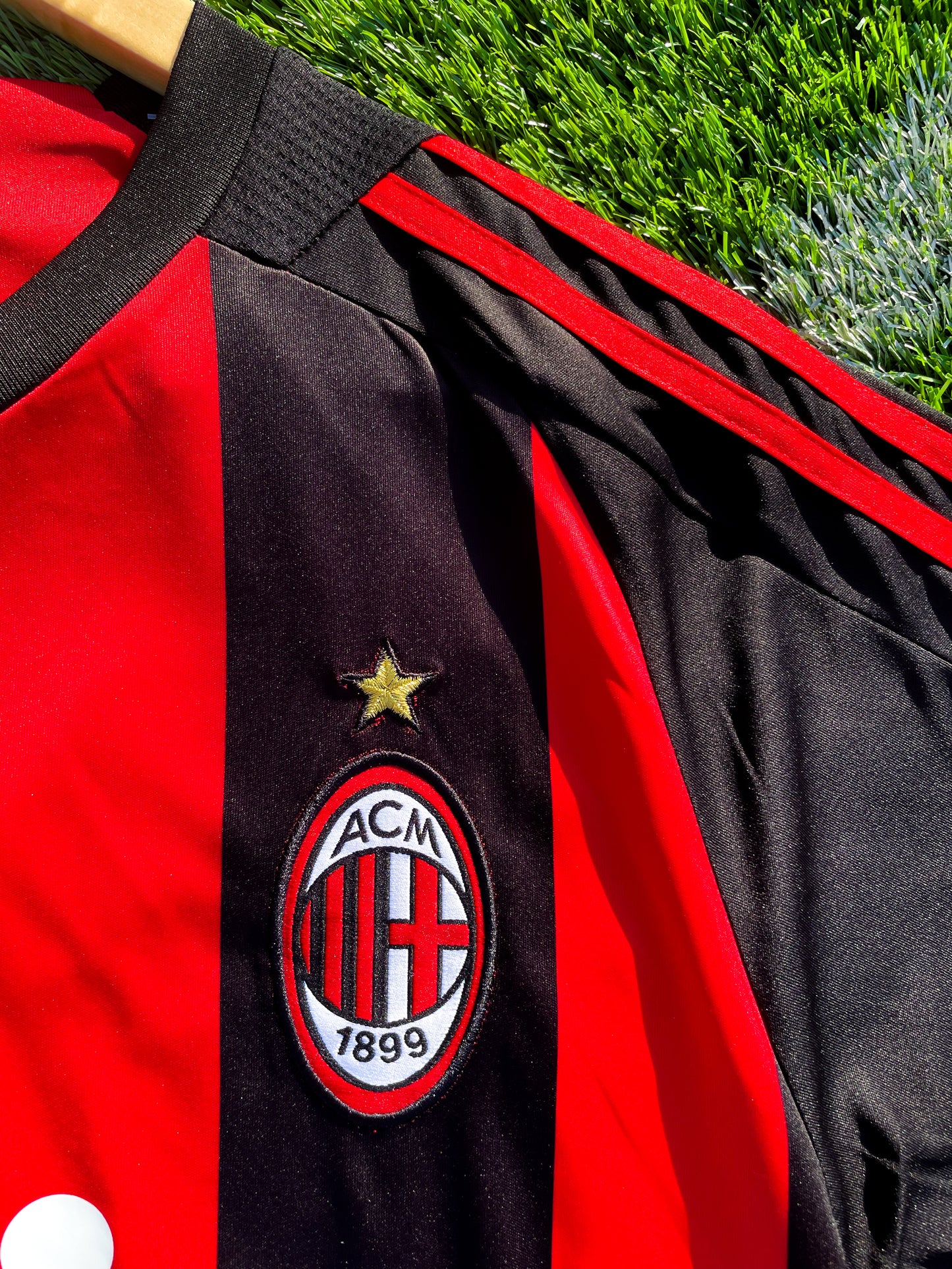 Close-up of Adidas stripes and Bwin sponsor logo