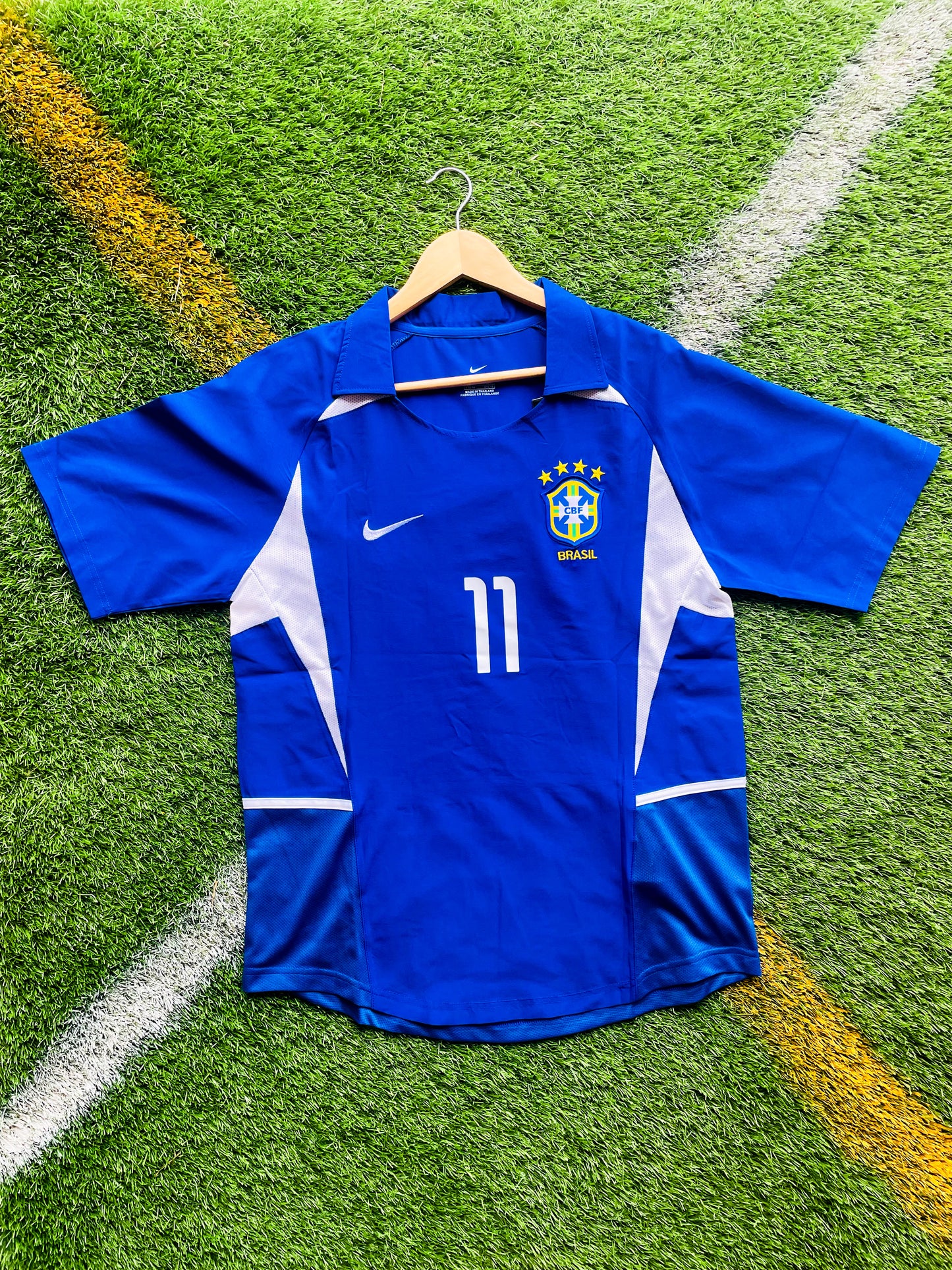 Front view of Brazil 2002 away Ronaldinho #11 vintage World Cup champions soccer jersey in blue and white