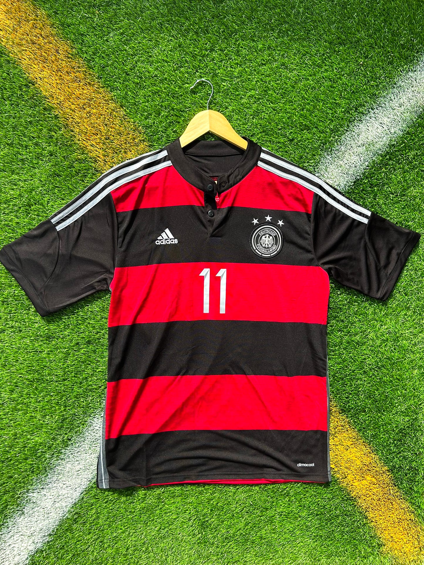 Front view of Germany 2014 away jersey with black and red horizontal stripes