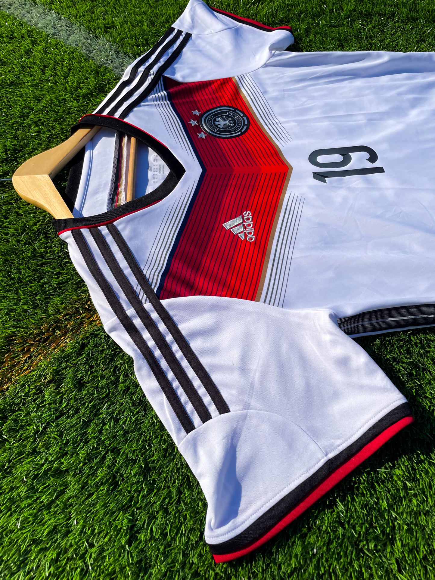 Close-up of Adidas logo and DFB crest on chest