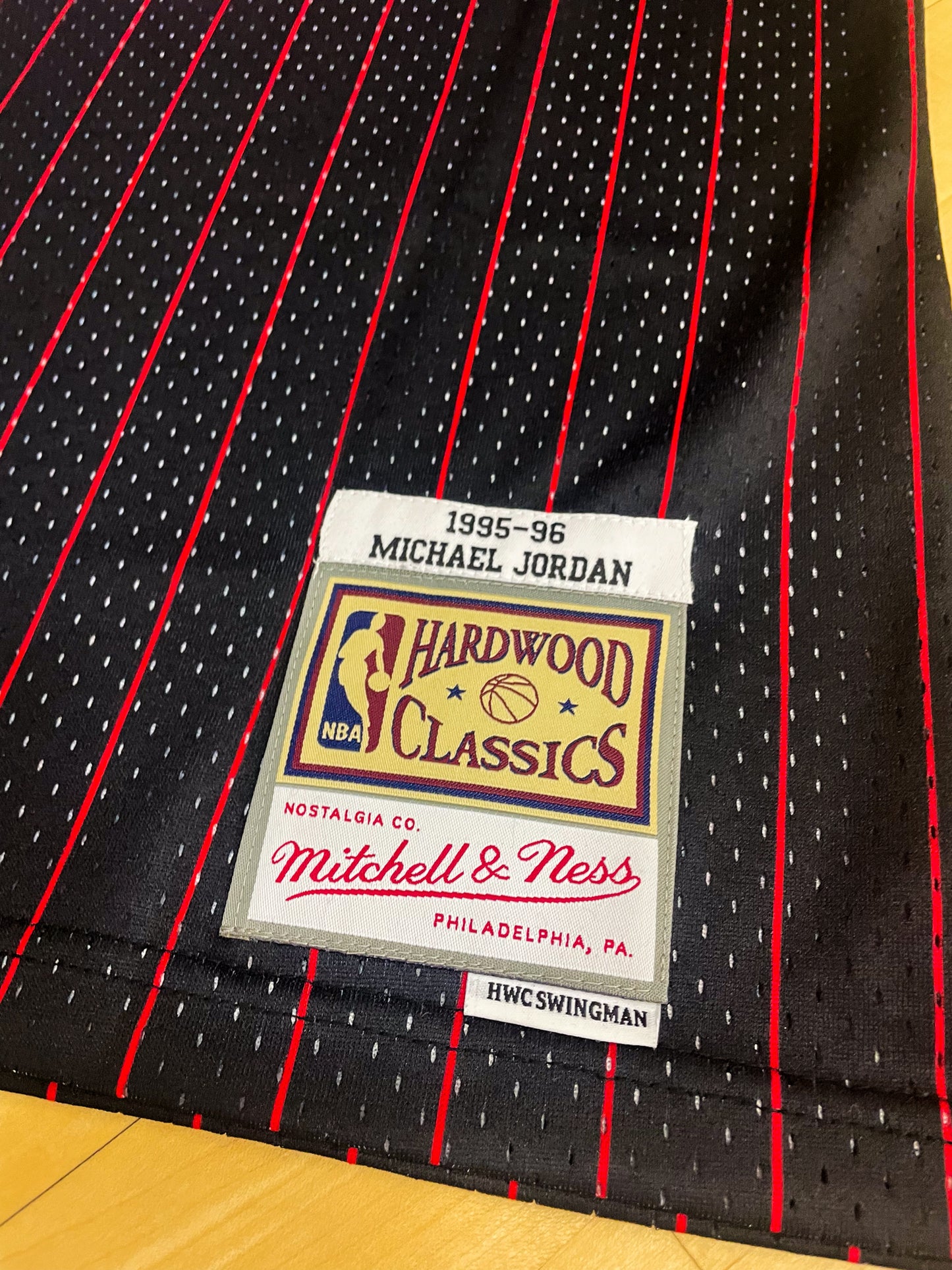 Close-up of Bulls logo and black mesh fabric details with red and white trim