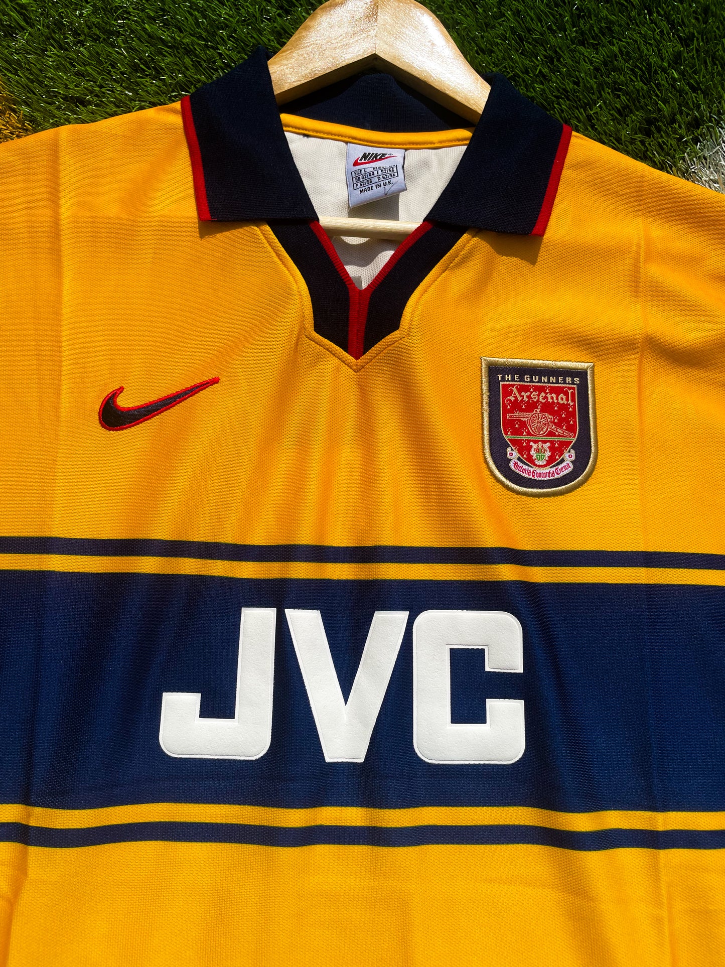 Close-up of Arsenal crest and JVC sponsor logo