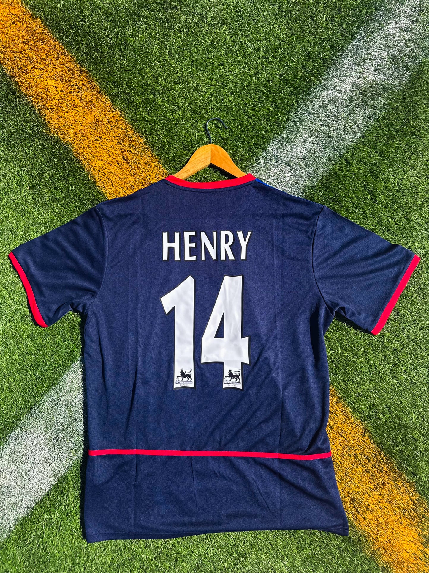 Back view showing Henry #14 in Premier League font on blue Arsenal away kit