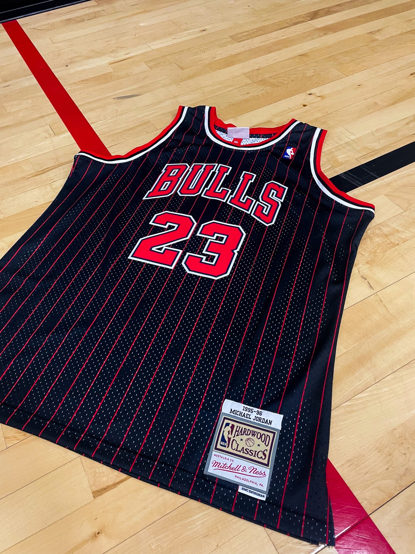 Close-up of Bulls logo and black mesh fabric details with red and white trim
