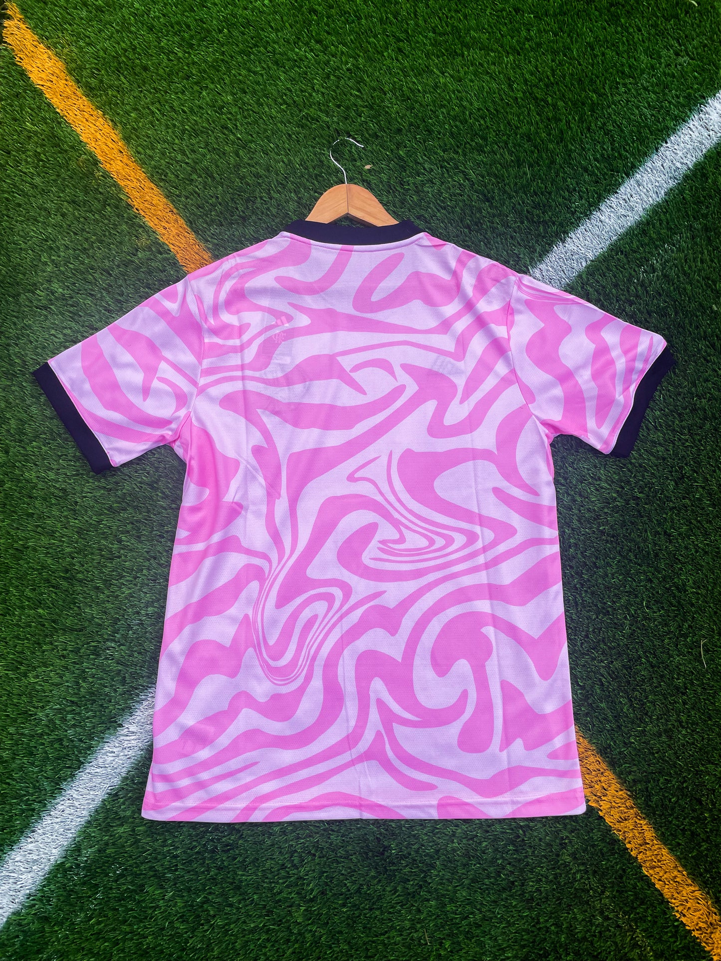 Back view showing pink colorway and clean silhouette