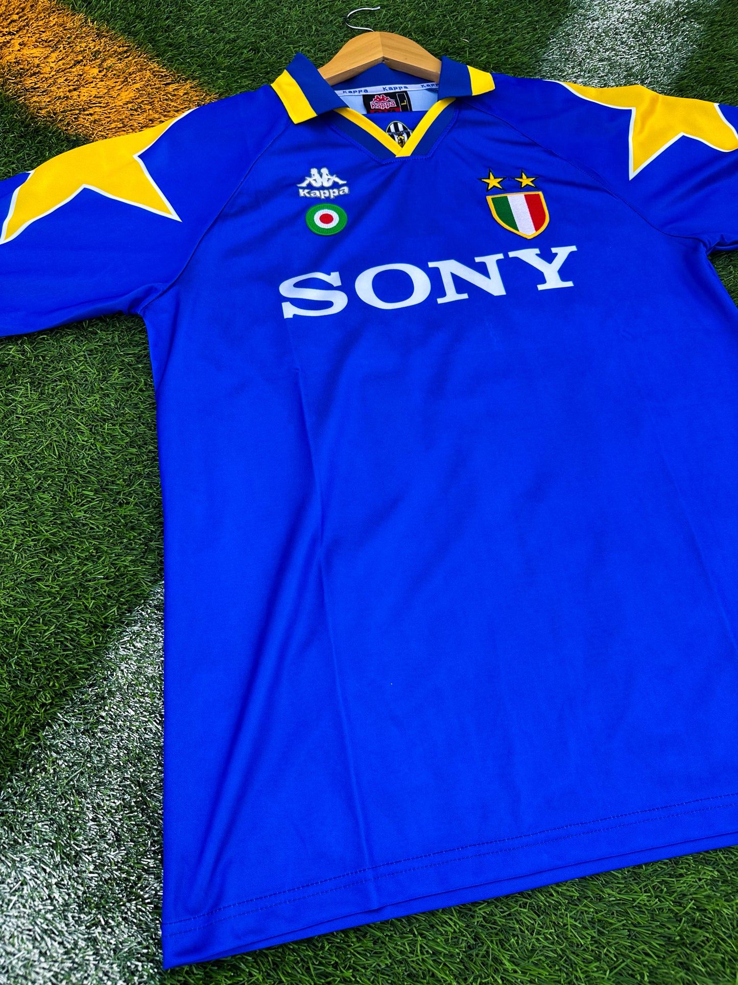 Close-up of Kappa logo and Sony sponsor on vintage Juventus jersey