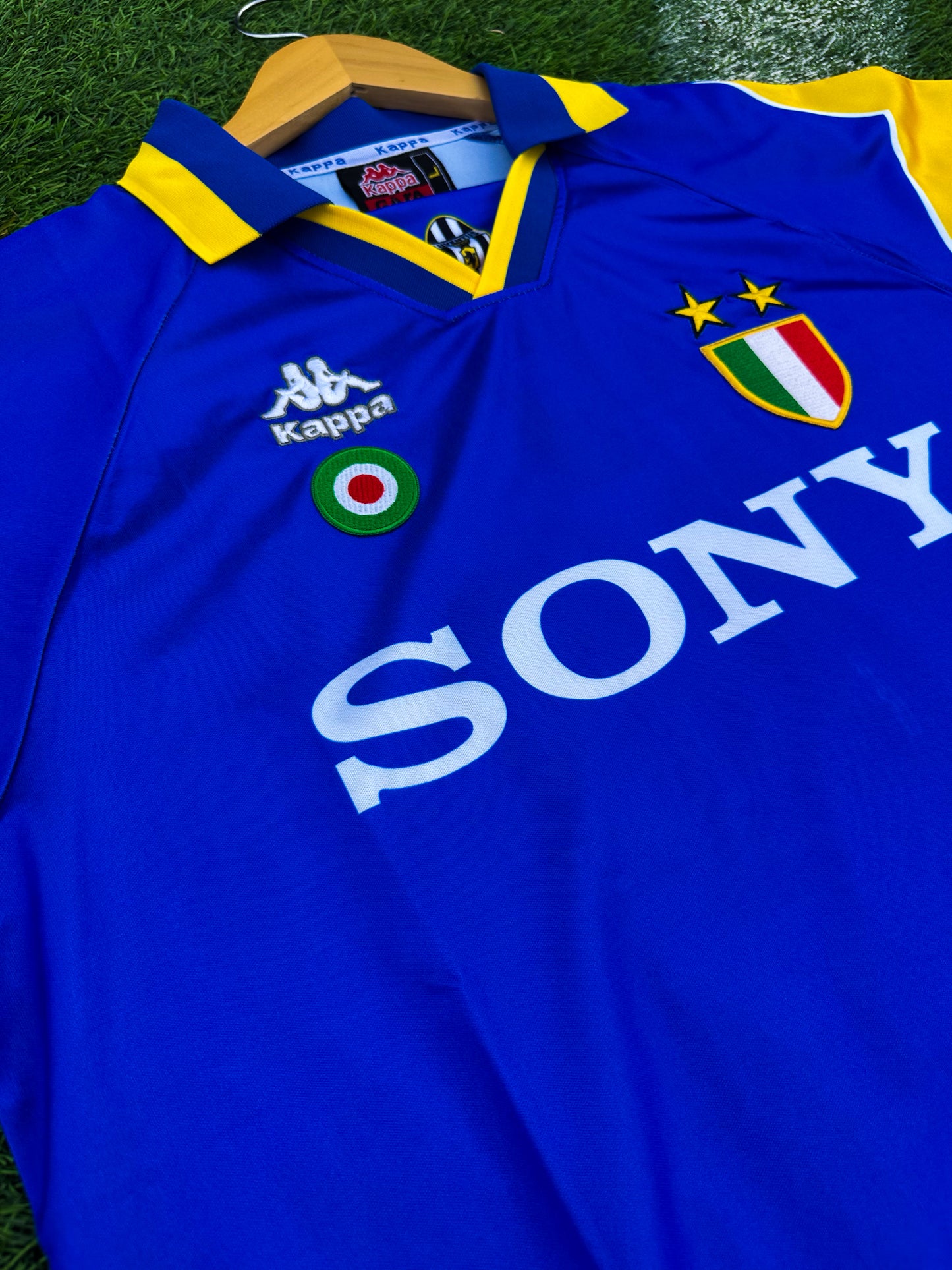 Close-up of Kappa logo and Sony sponsor on vintage Juventus jersey