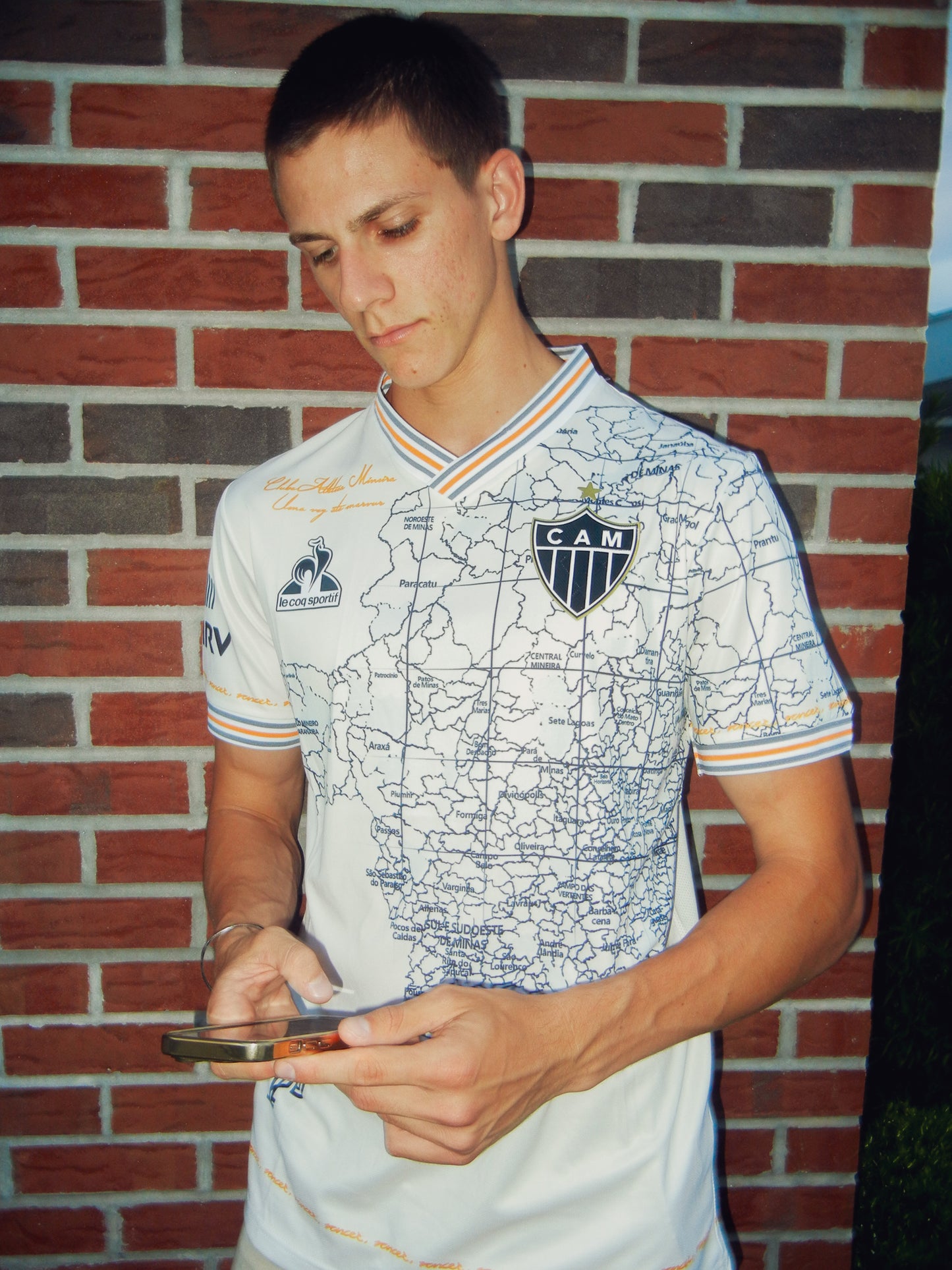 Styled model wearing the Atlético Mineiro anniversary jersey in a city setting
