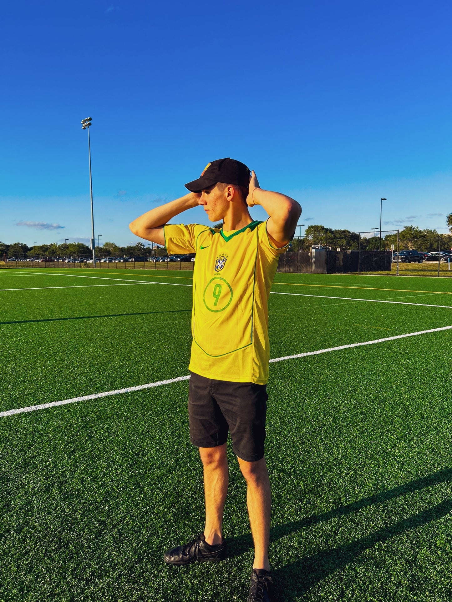 Model wearing the Brazil 2004 Home Ronaldo and Ronaldinho jersey