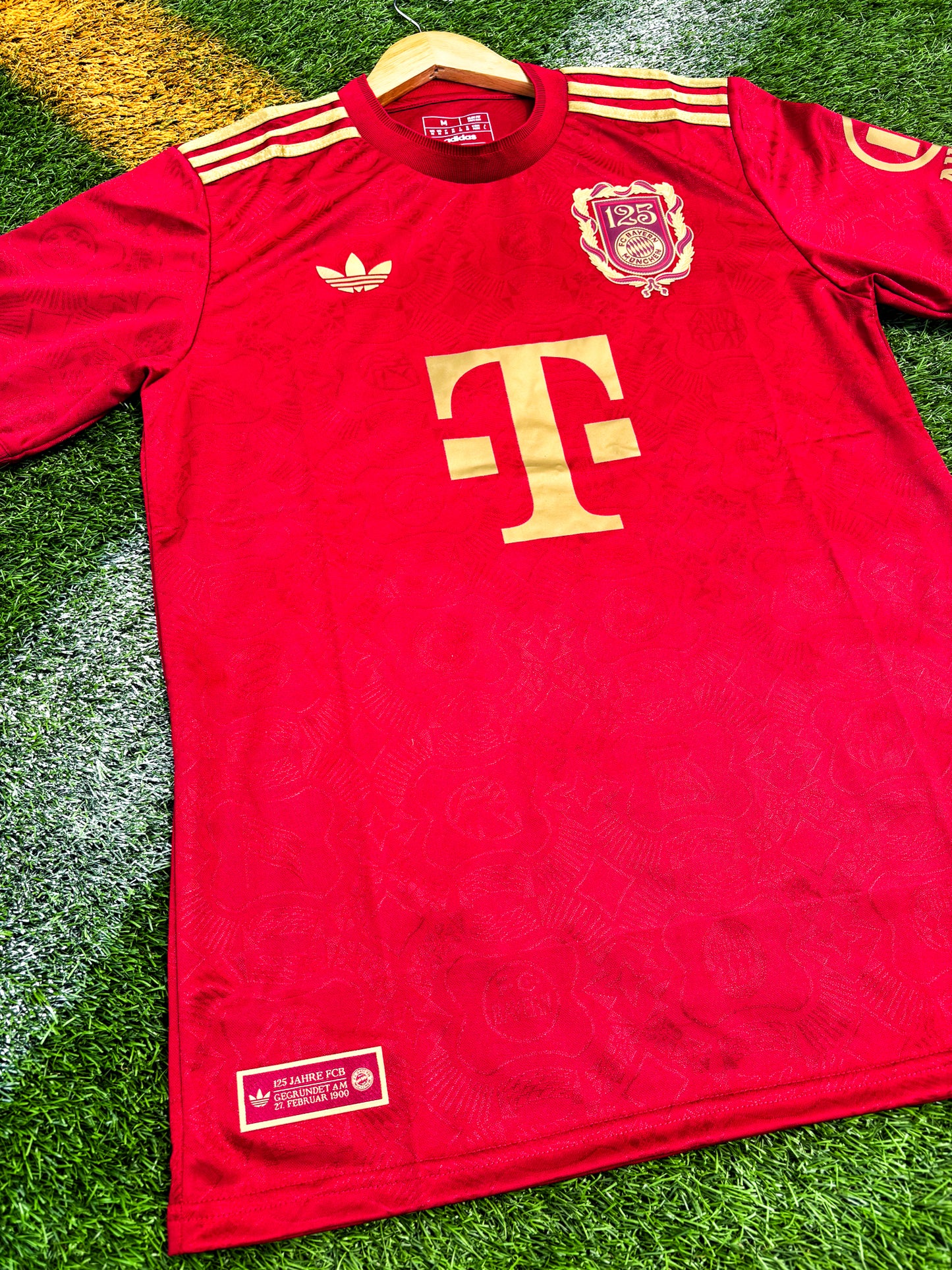 Close-up of Bayern Munich club crest and anniversary badge