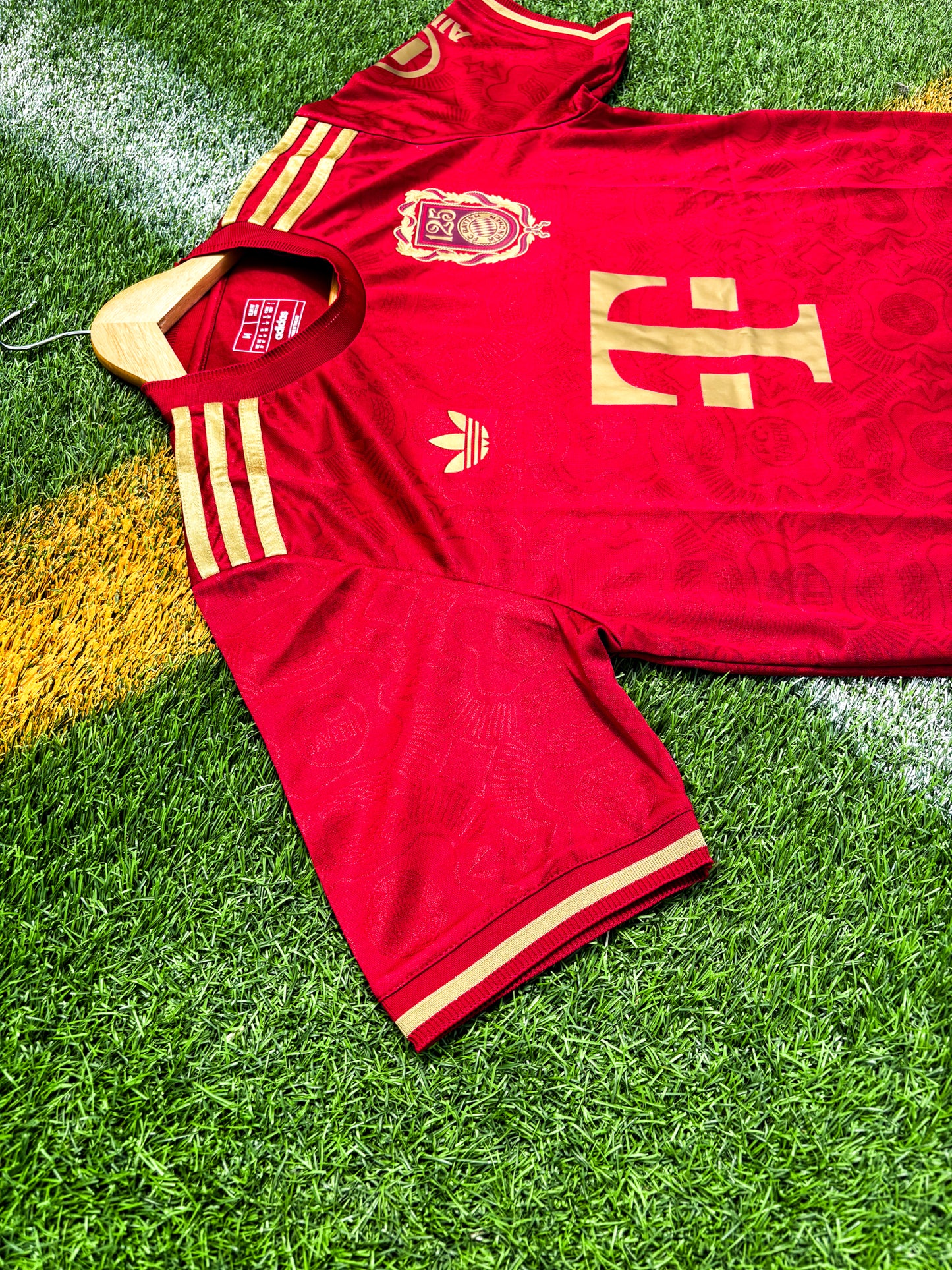 Close-up of Bayern Munich club crest and anniversary badge