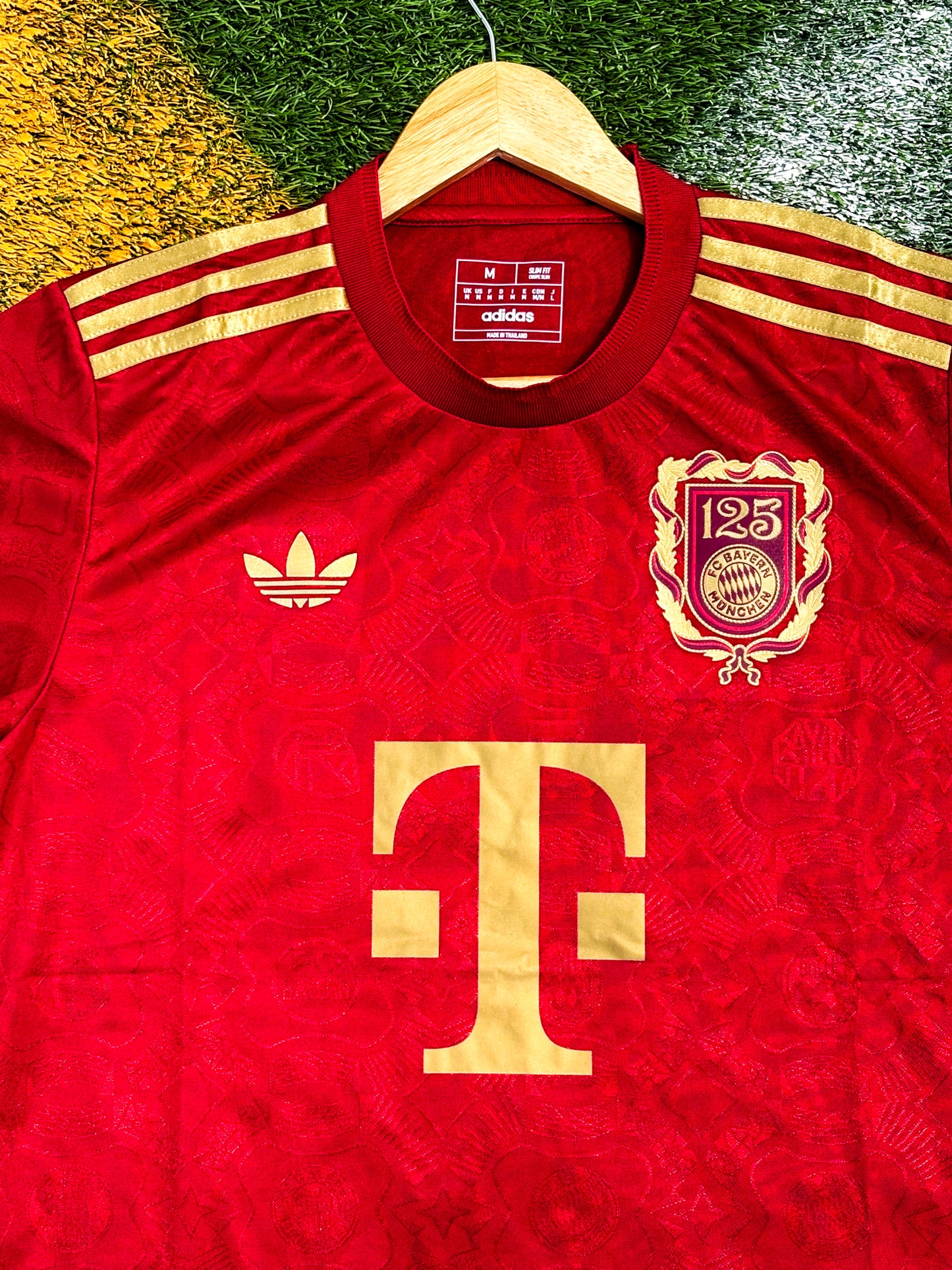 Close-up of Bayern Munich club crest and anniversary badge