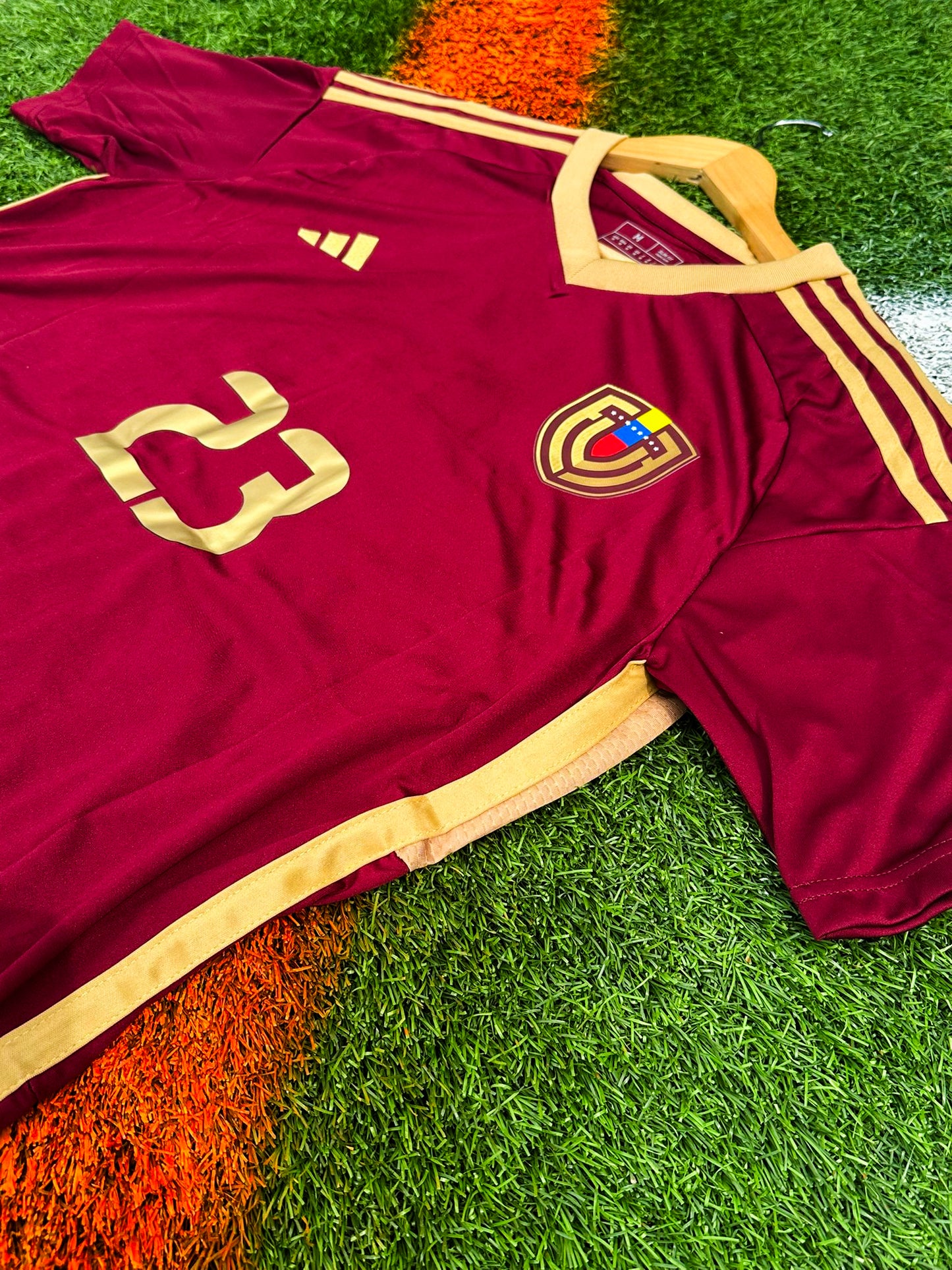 Close-up detail of crest and fabric on Venezuela 2024 Copa America jersey
