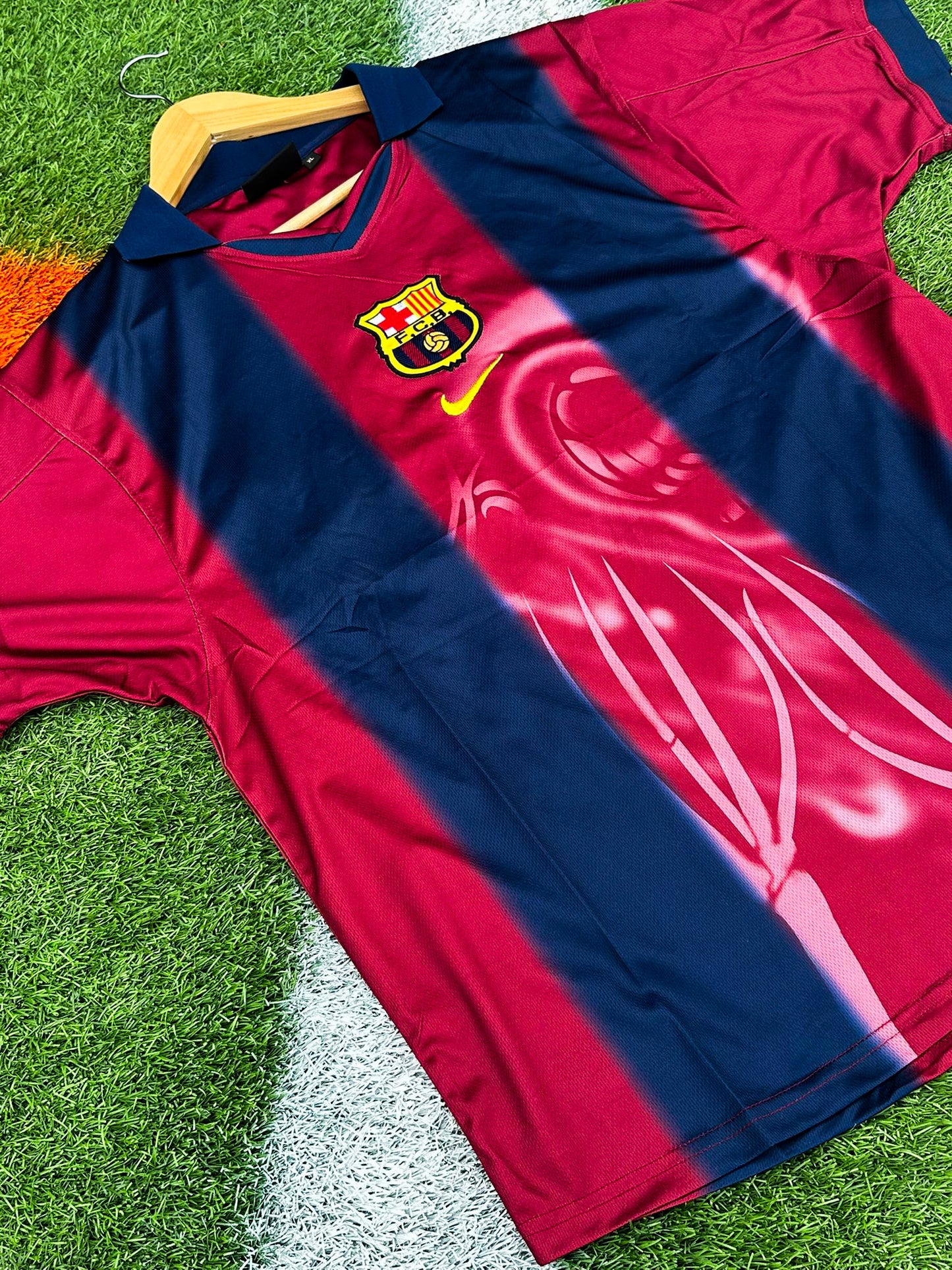 Close-up of Barcelona x Cactus Jack badge and Nike logo on 2024/2025 Home Jersey