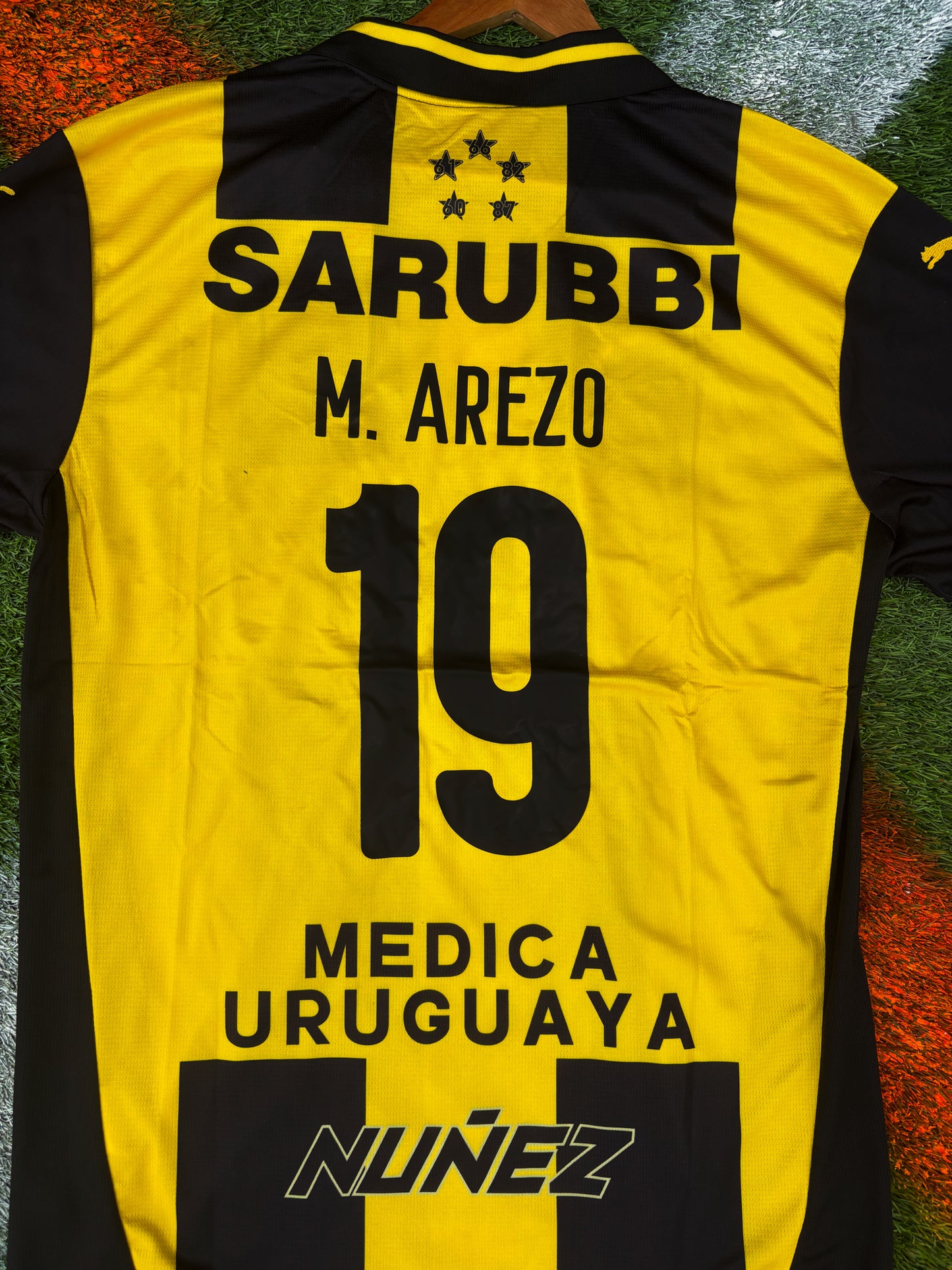 Peñarol 2025 Home Jersey – Arezo #19 – Classic Stripes by Puma