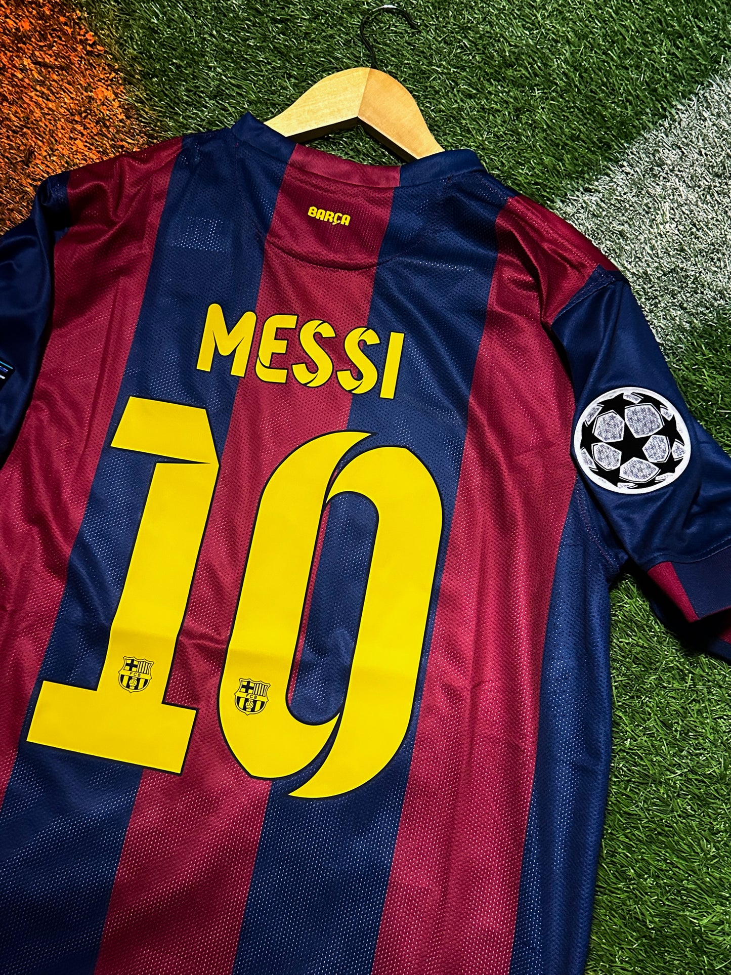 FC Barcelona 2014-15 home jersey with Messi #10, red and blue stripes, Champions League patch.