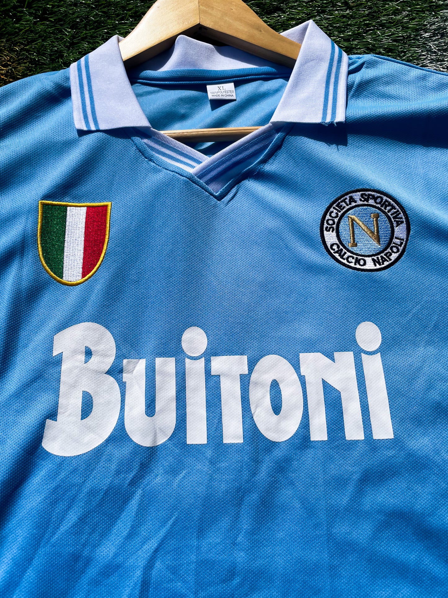 Close-up of Napoli crest and vintage collar detail