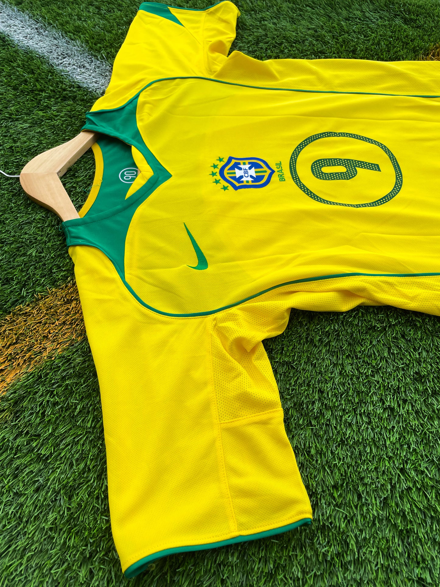 Fabric detail showing yellow base and green trim on Brazil 2004 kit