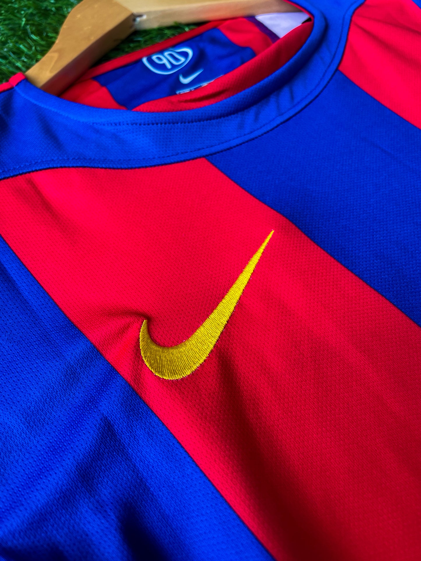 Close-up of embroidered crest and Nike logo on 2004-2005 kit
