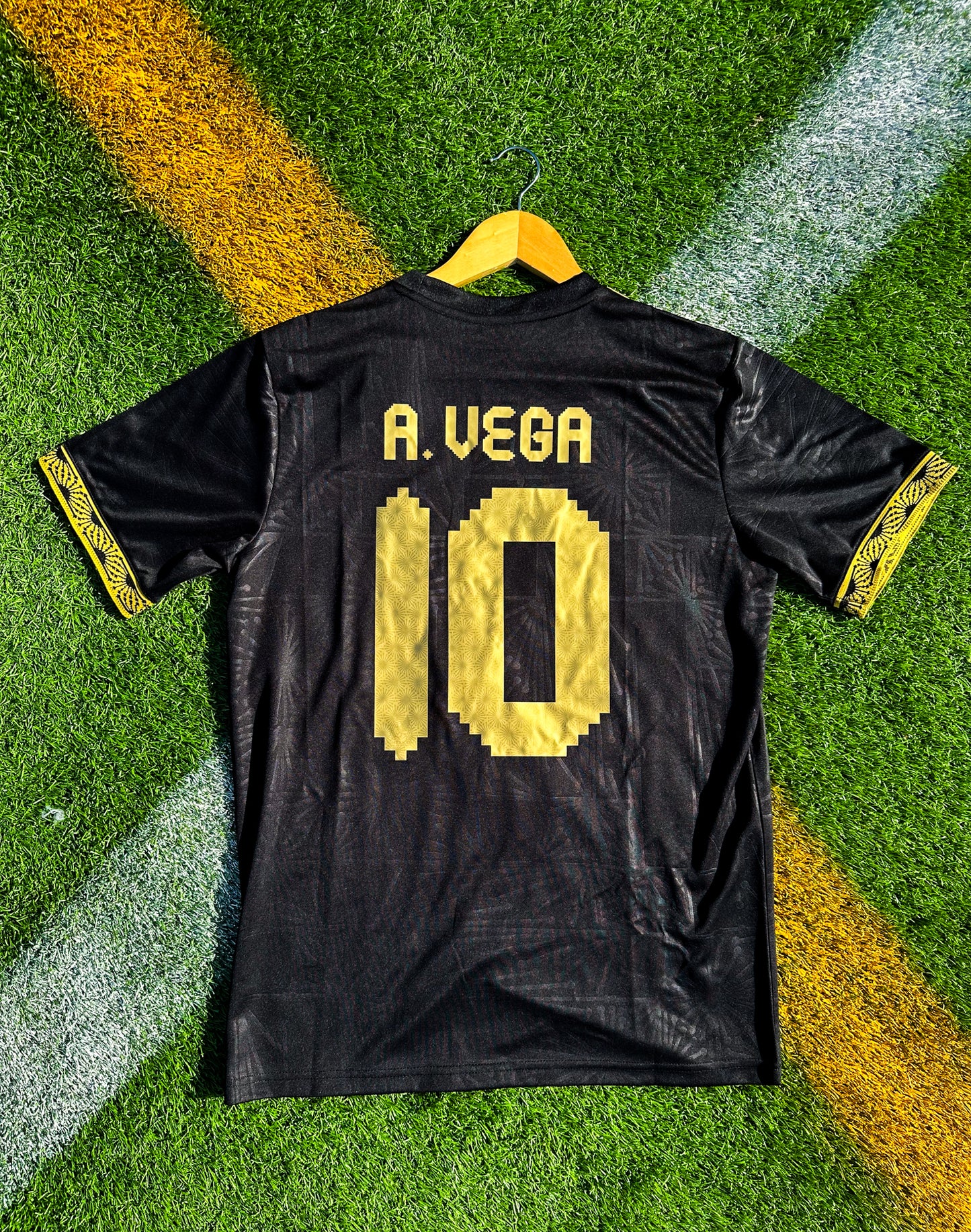 Back view showing A Vega #10 print on black jersey