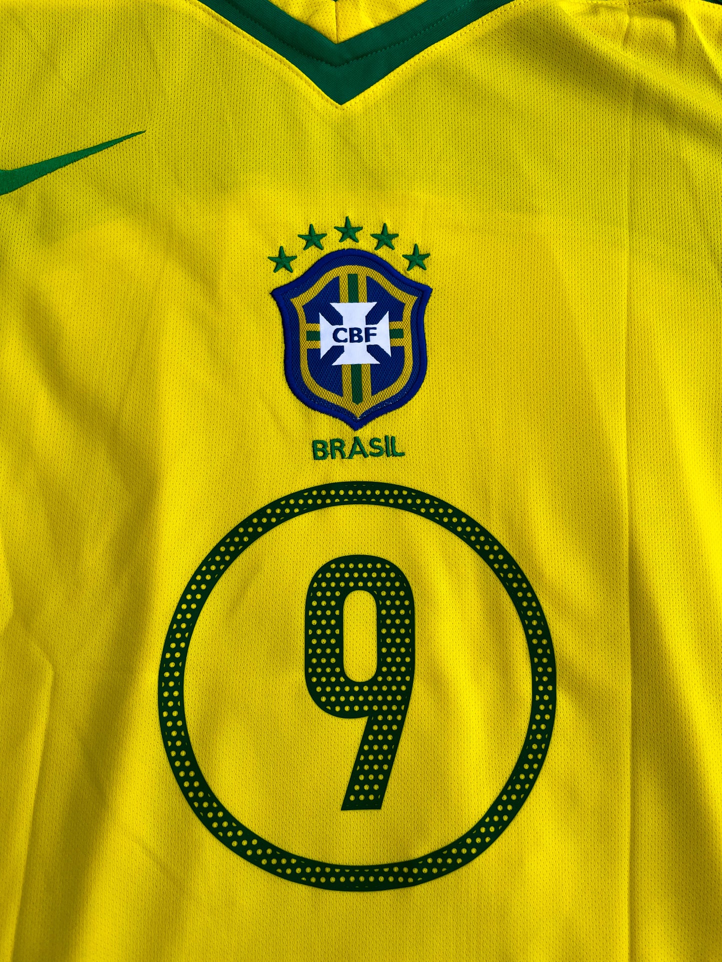 Fabric detail showing yellow base and green trim on Brazil 2004 kit