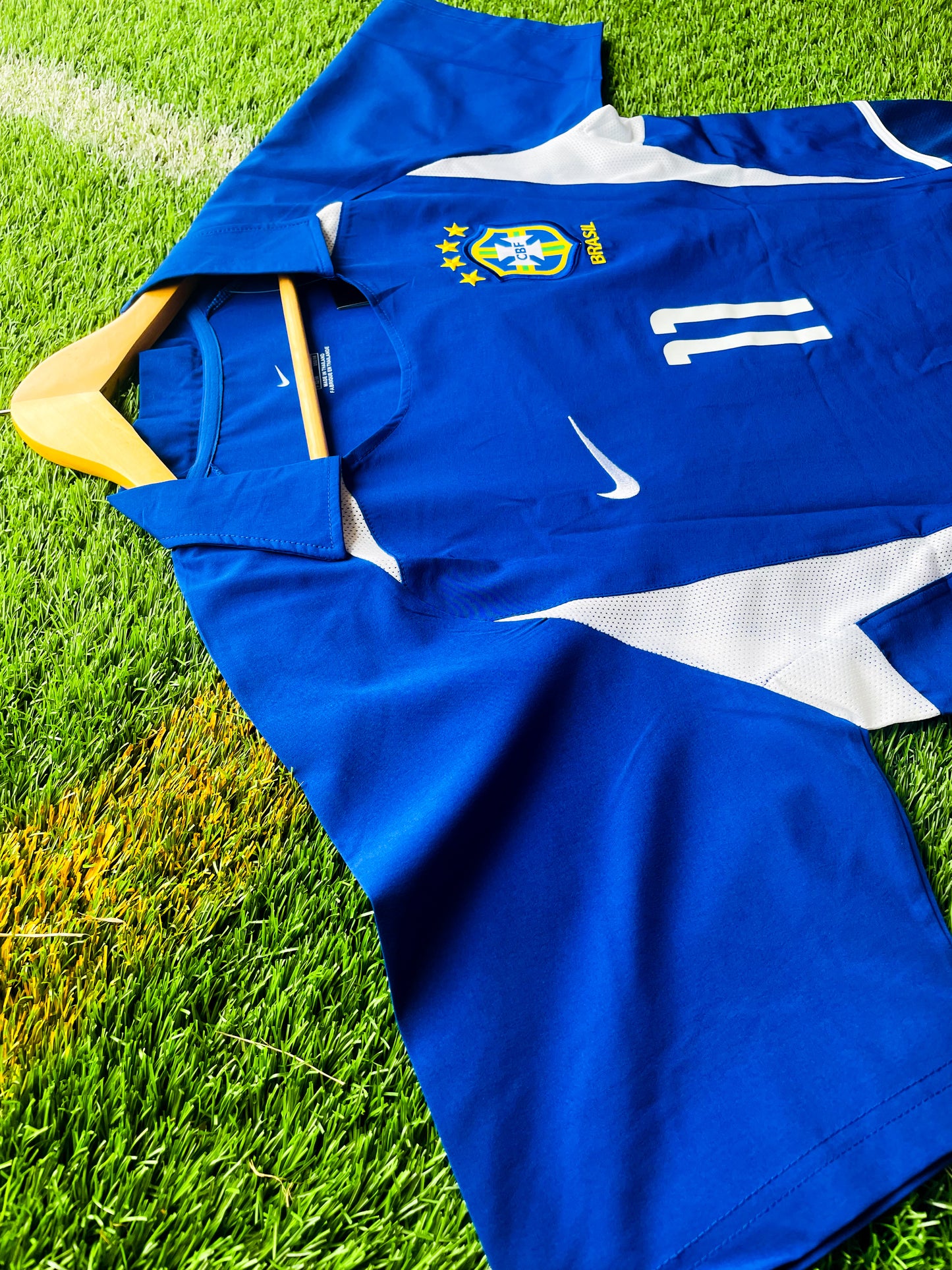 Front view of Brazil 2002 away Ronaldinho #11 vintage World Cup champions soccer jersey in blue and white