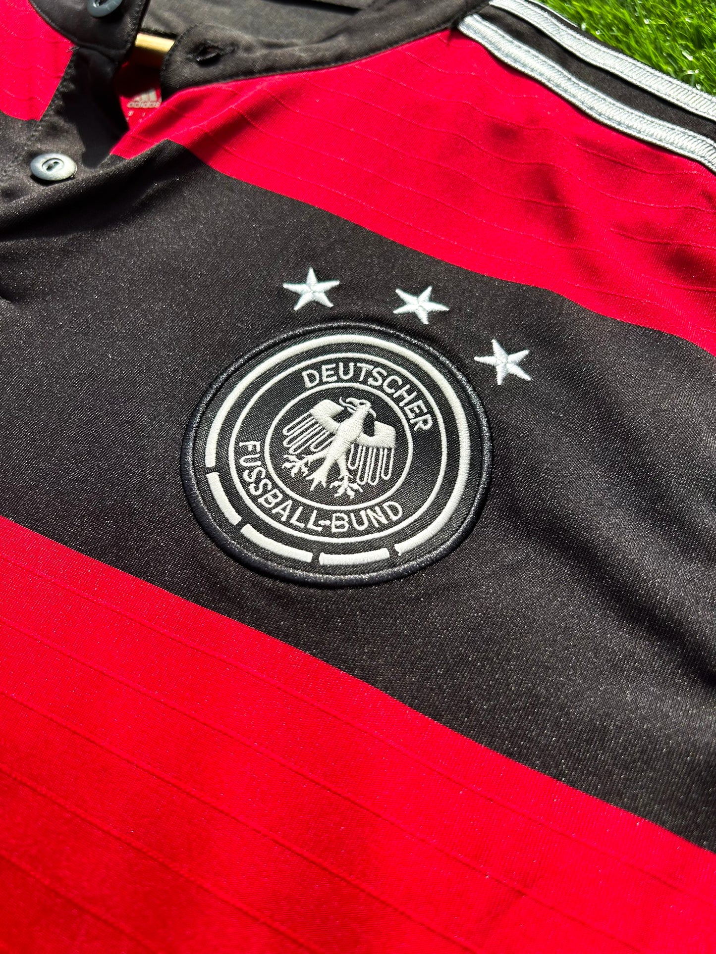 Close-up of DFB crest and Adidas logo on chest