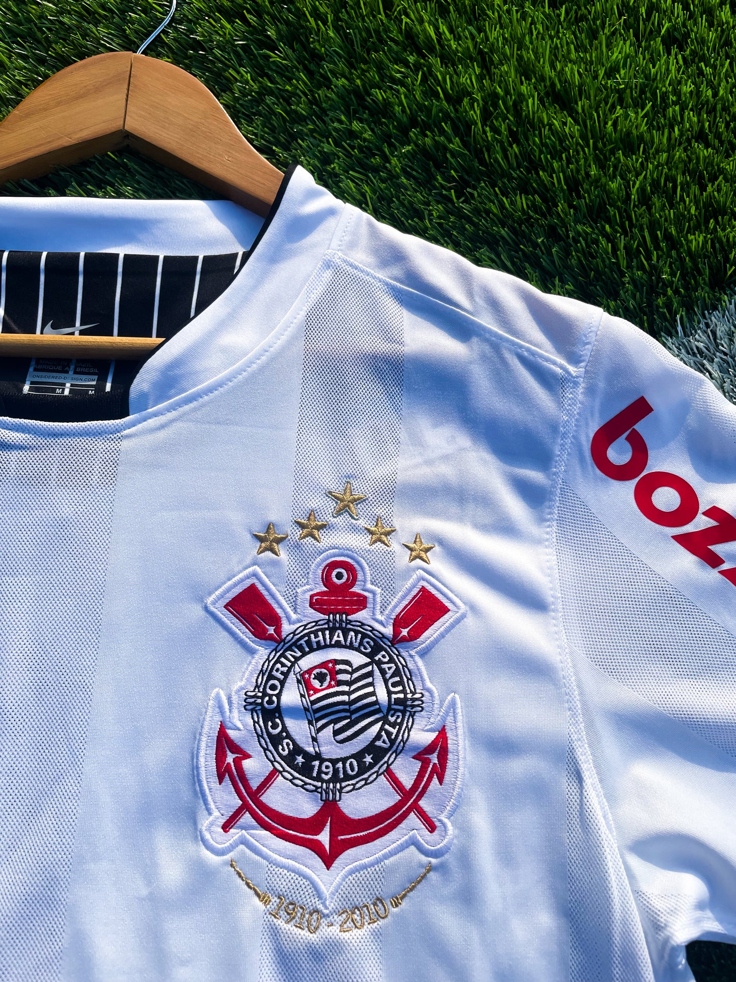 Close-up of retro Corinthians crest and collar detail