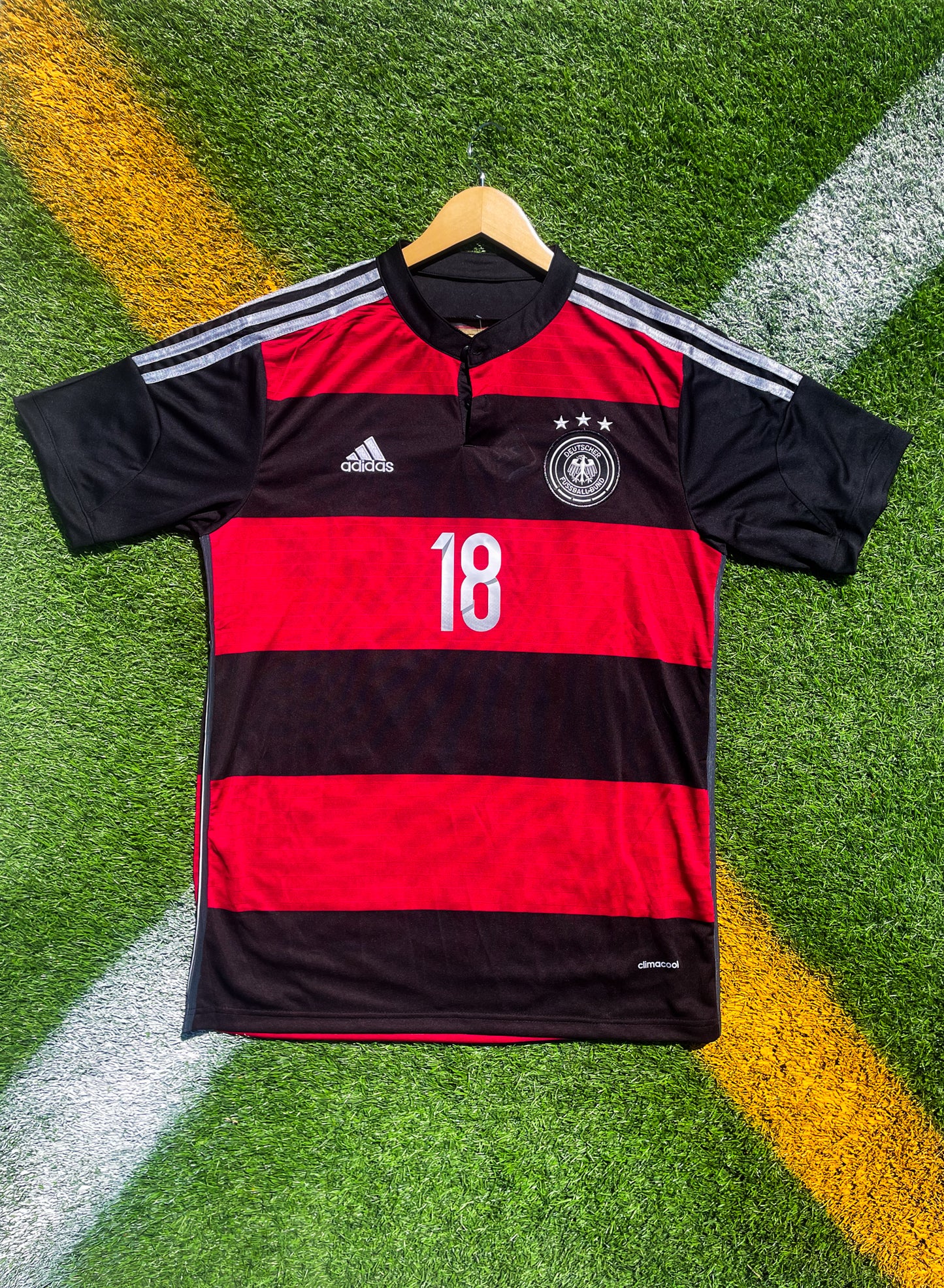 Front view of Germany 2014 away jersey with black and red horizontal stripes