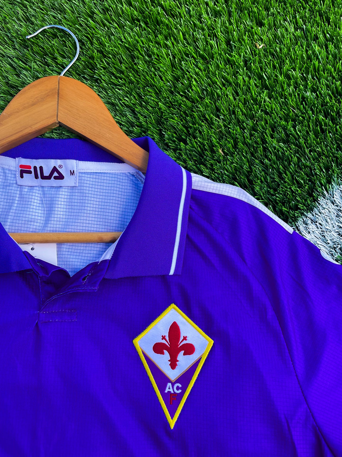 Close-up of embroidered Fiorentina crest and Nintendo logo