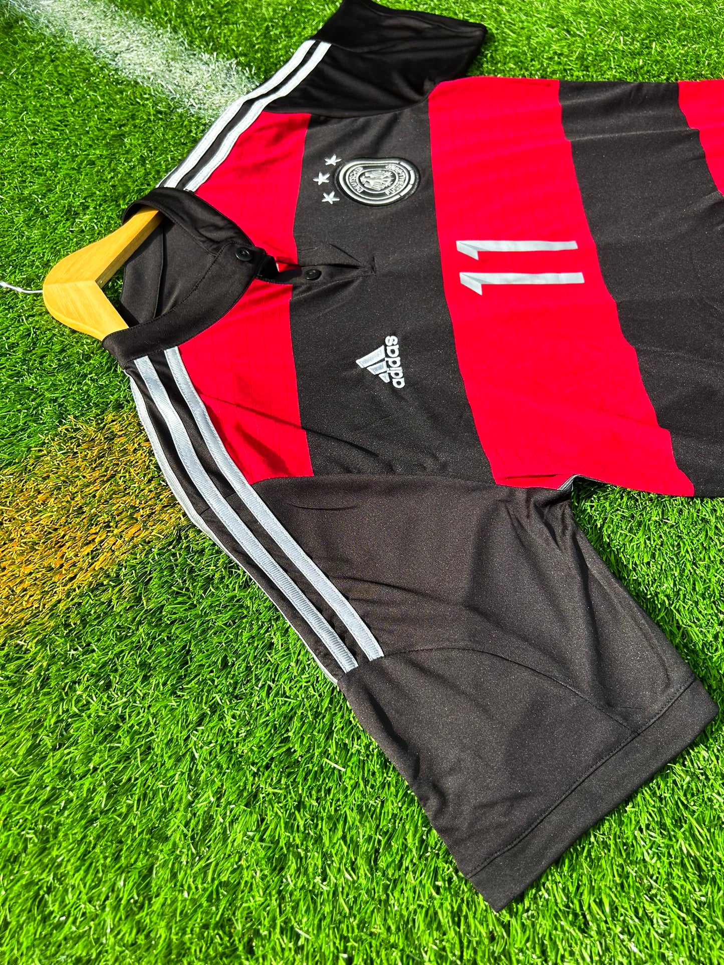 Close-up of DFB crest and Adidas logo on chest